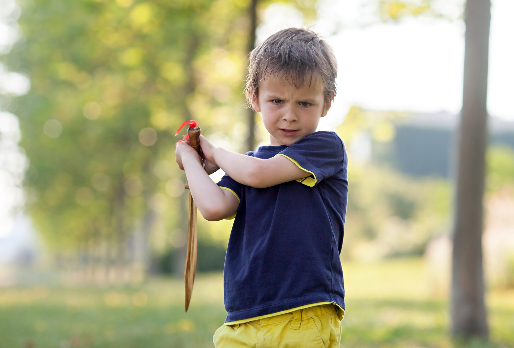 Oppositional Defiant Disorder (ODD) and ADHD plays with a toy sword.