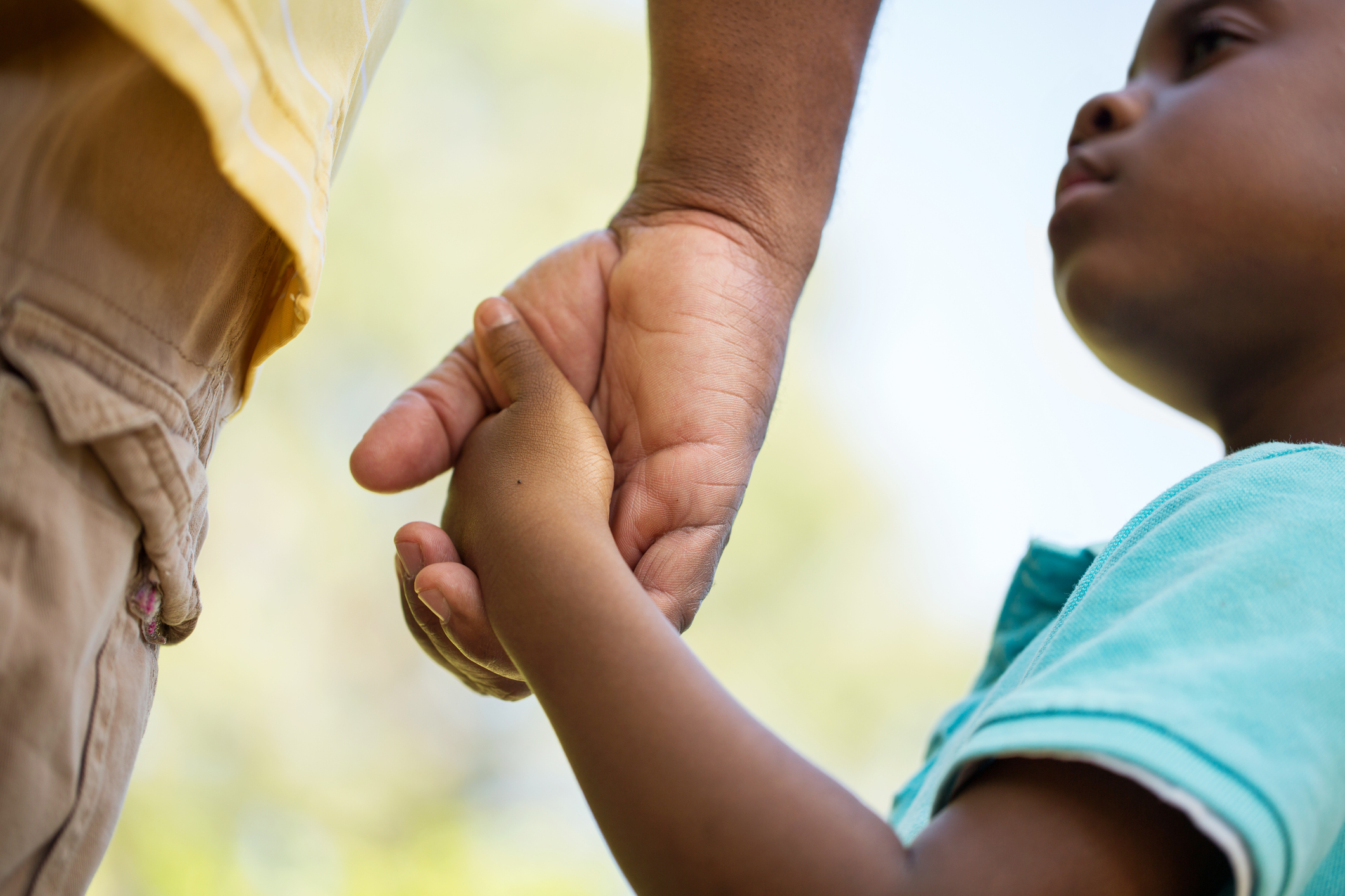 Child holding father's hand