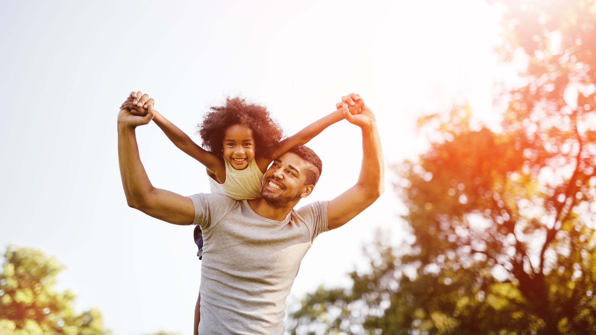 A happy father practicing mindful parenting on his daughter with ADHD