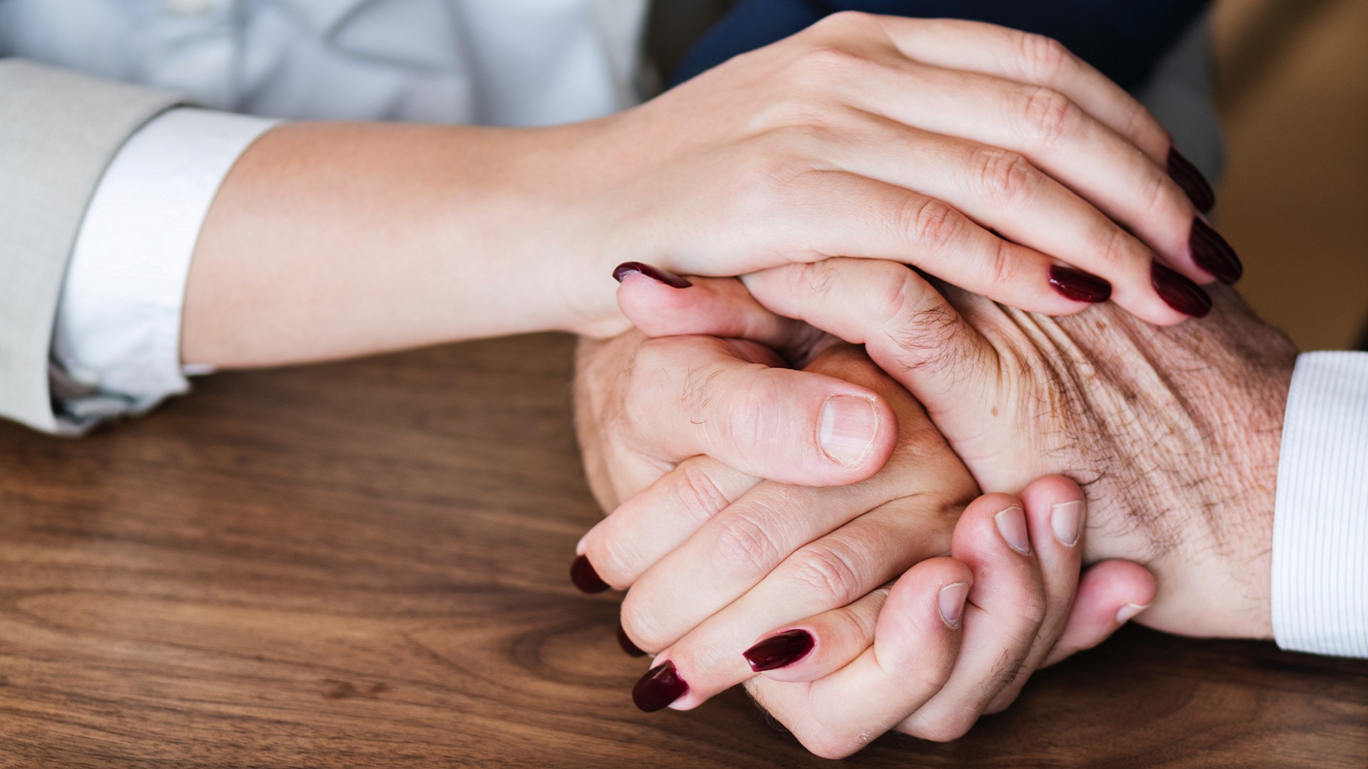 A woman and a man hold hands while talking about ADD and relationships.