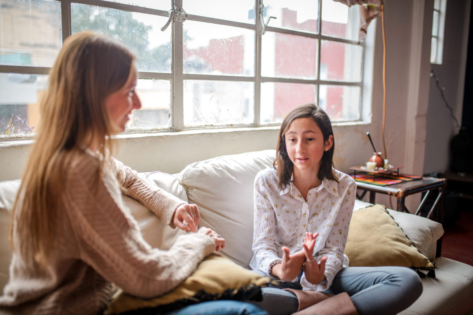 Mother and daughter at home having a  talk at home