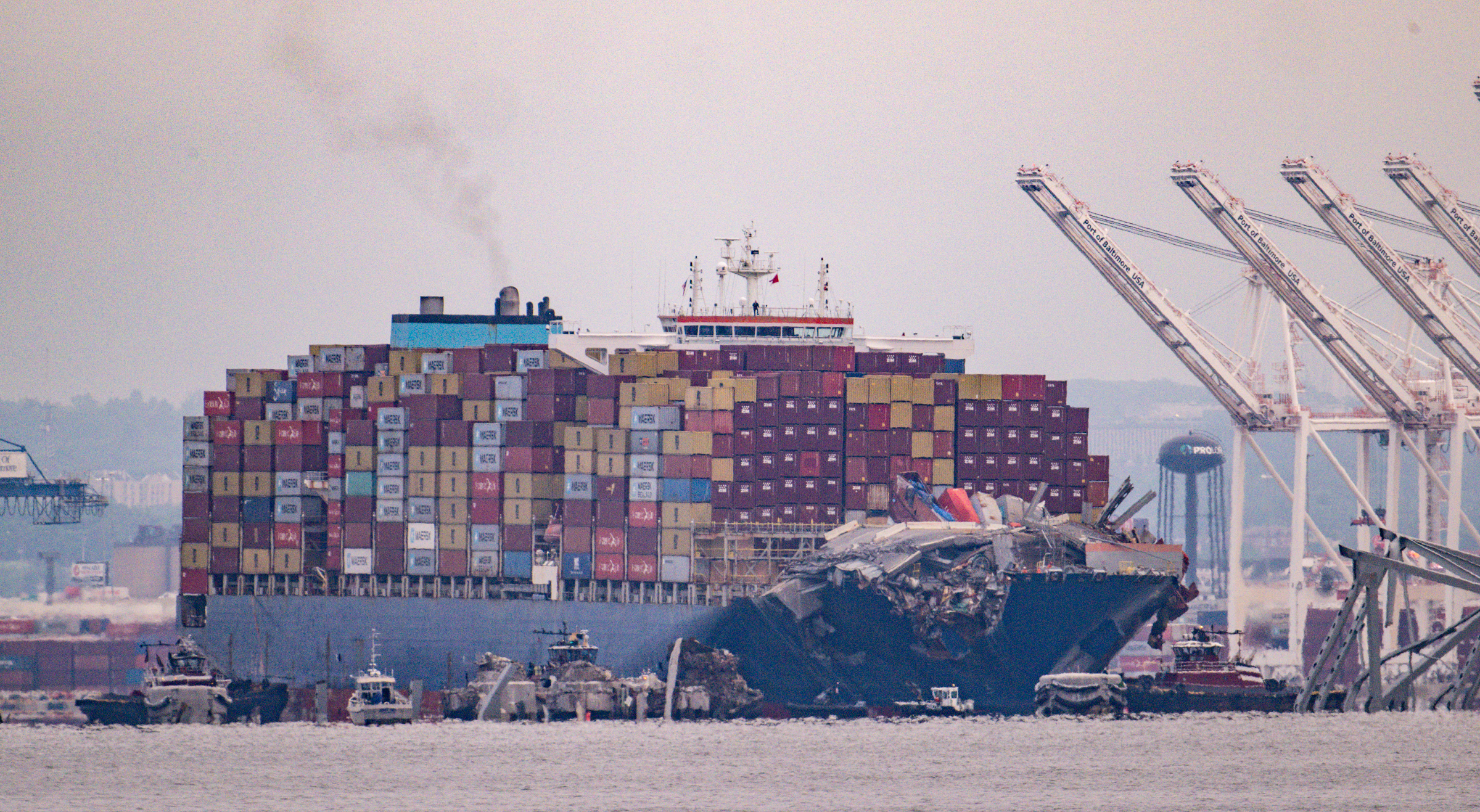 Tug boats push the container ship Dali from the wreckage of the Francis Scott Key Bridge fifty-five days after it hit a structural pier causing a catastrophic collapse.(Jerry Jackson/Staff)