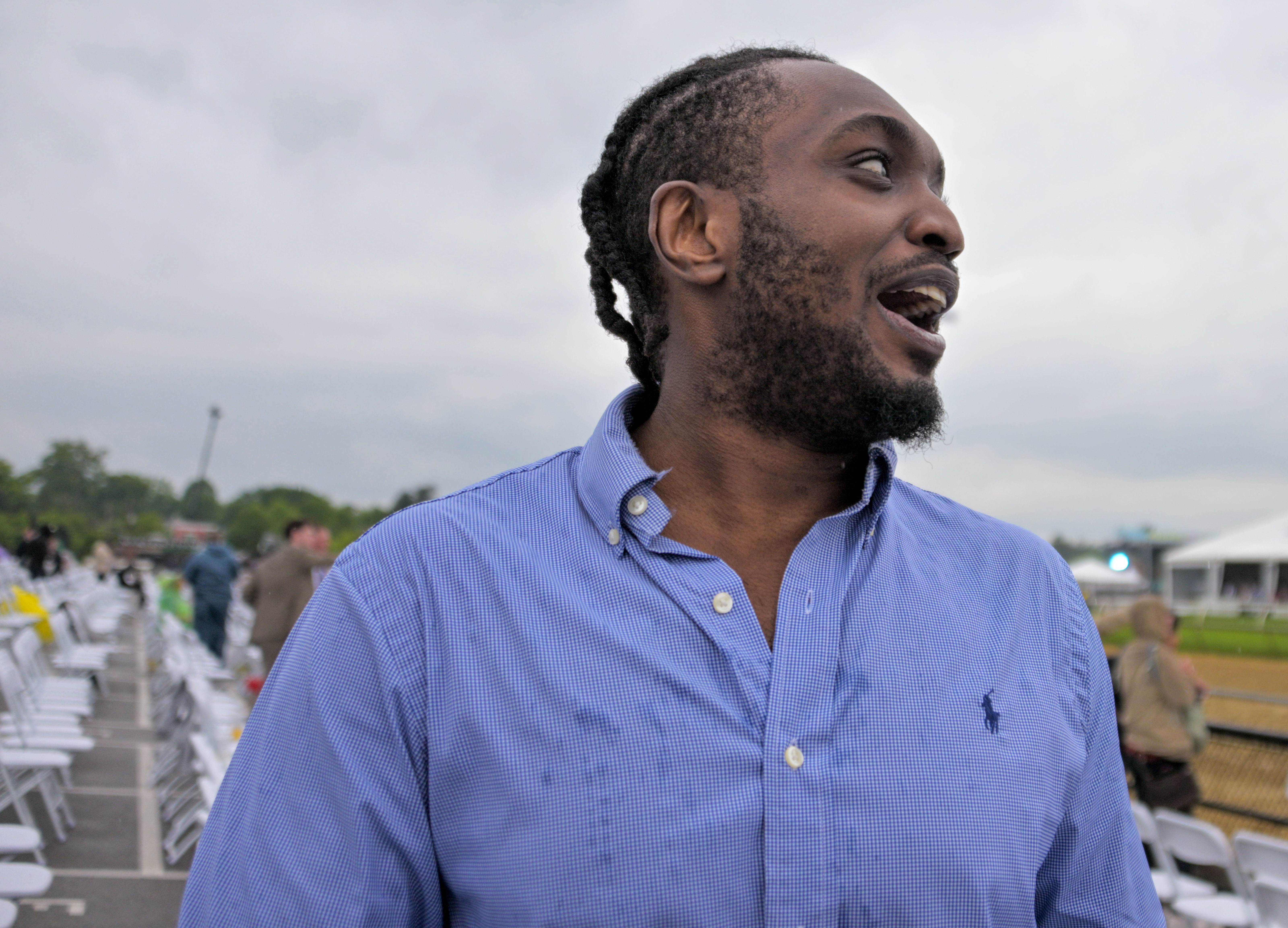 Ryan Aug.us of Freehold, NJ reacts toward friends, before heading to claim his winnings after scoring on his $50 bet on Corporate Power, ridden by jockey Javier Castellano in the 26th running of the Sir Barton Stakes the during Preakness day at Pimlico Race Course. (Karl Merton Ferron/Staff)