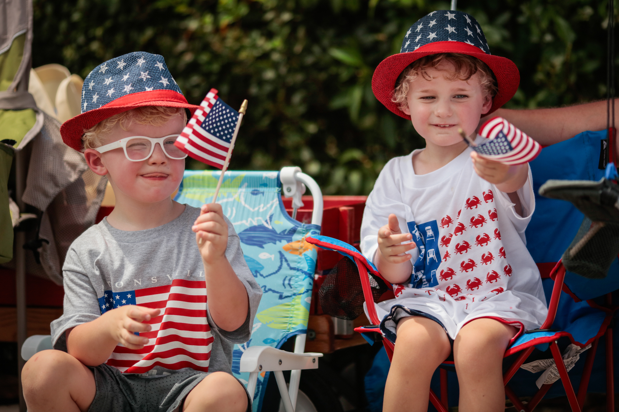 Desmond Thill, 4, of Catonsville, left, and Leon Kyprianou, 3, watch along the 4th of July parade route on Frederick Road in Catonsville. (Nate Pesce/Freelance)