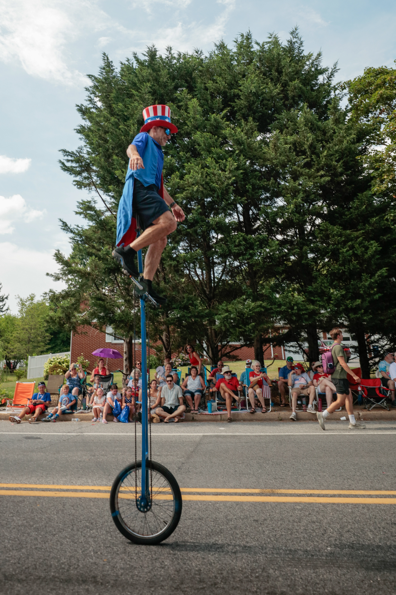 A stilt-style unicycle rider during the 78th annual Catonsville 4th of July parade. (Nate Pesce/Freelance)