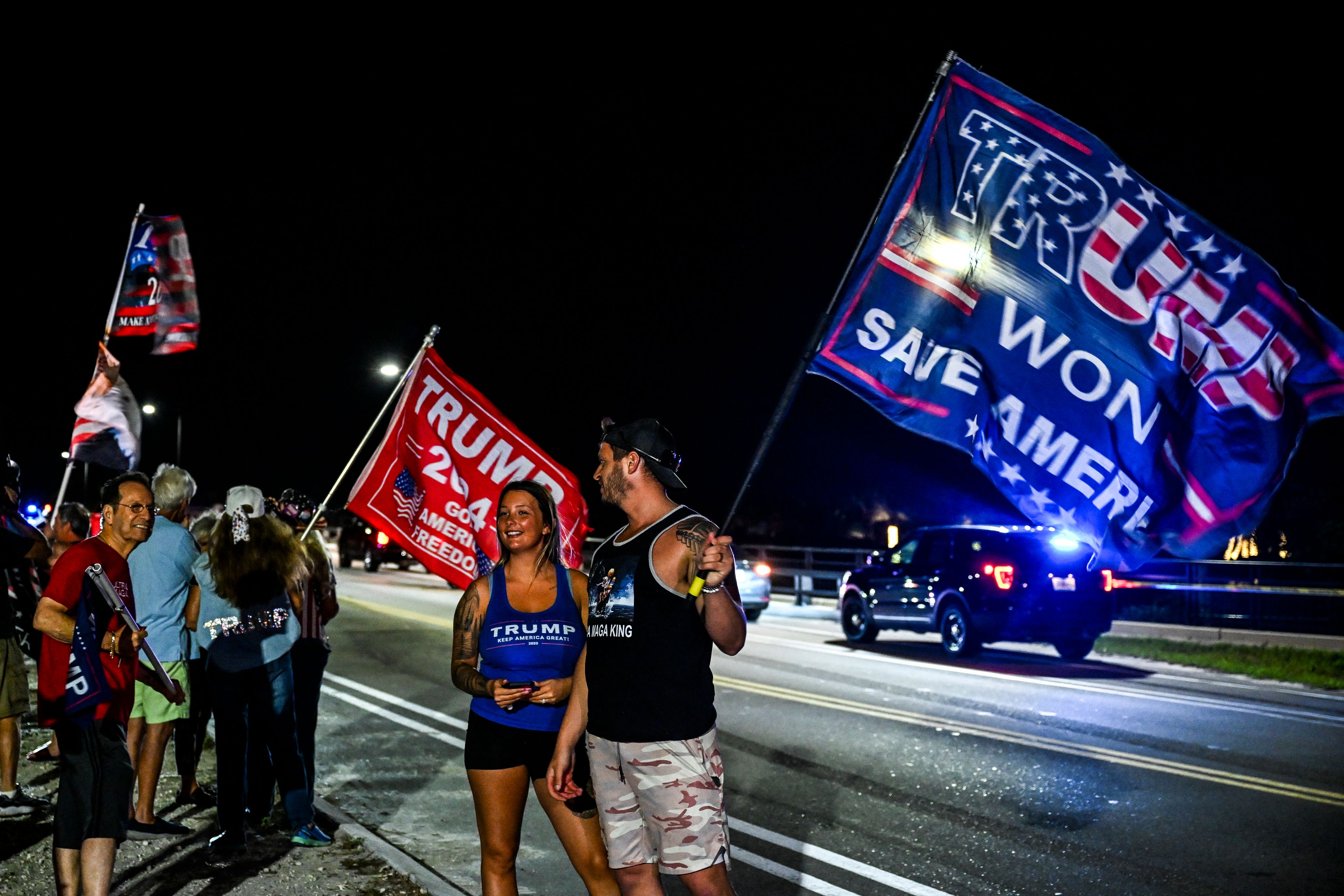 Supporters of former US President Donald Trump protest near the Mar-a-Lago Club in Palm Beach, Florida, on March 30, 2023. - A New York grand jury has voted to indict former US president Donald Trump over hush money payments made to porn star Stormy Daniels ahead of the 2016 election, multiple US media reported on March 30, 2023. (Photo by CHANDAN KHANNA/AFP via Getty Images)