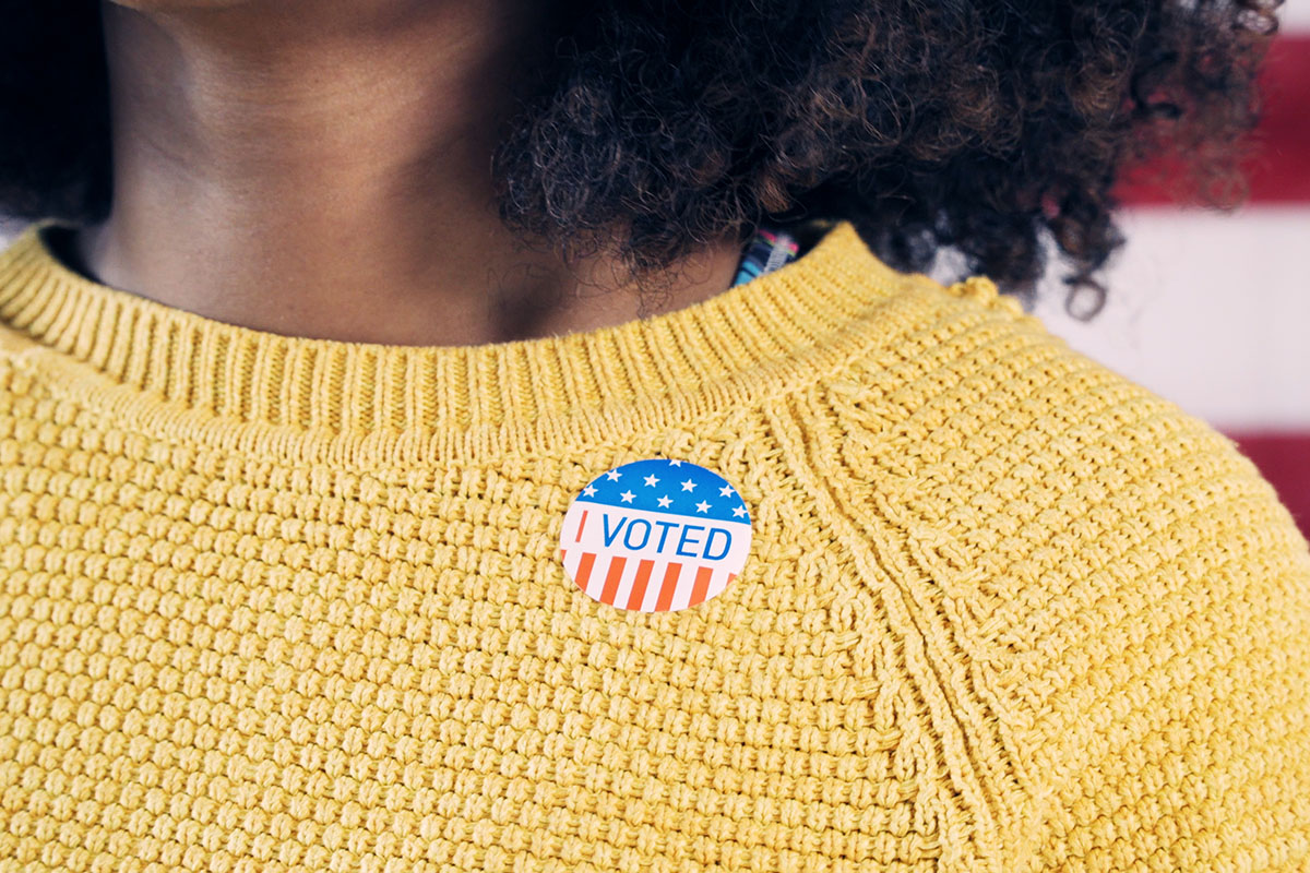 woman wearing i voted sticker