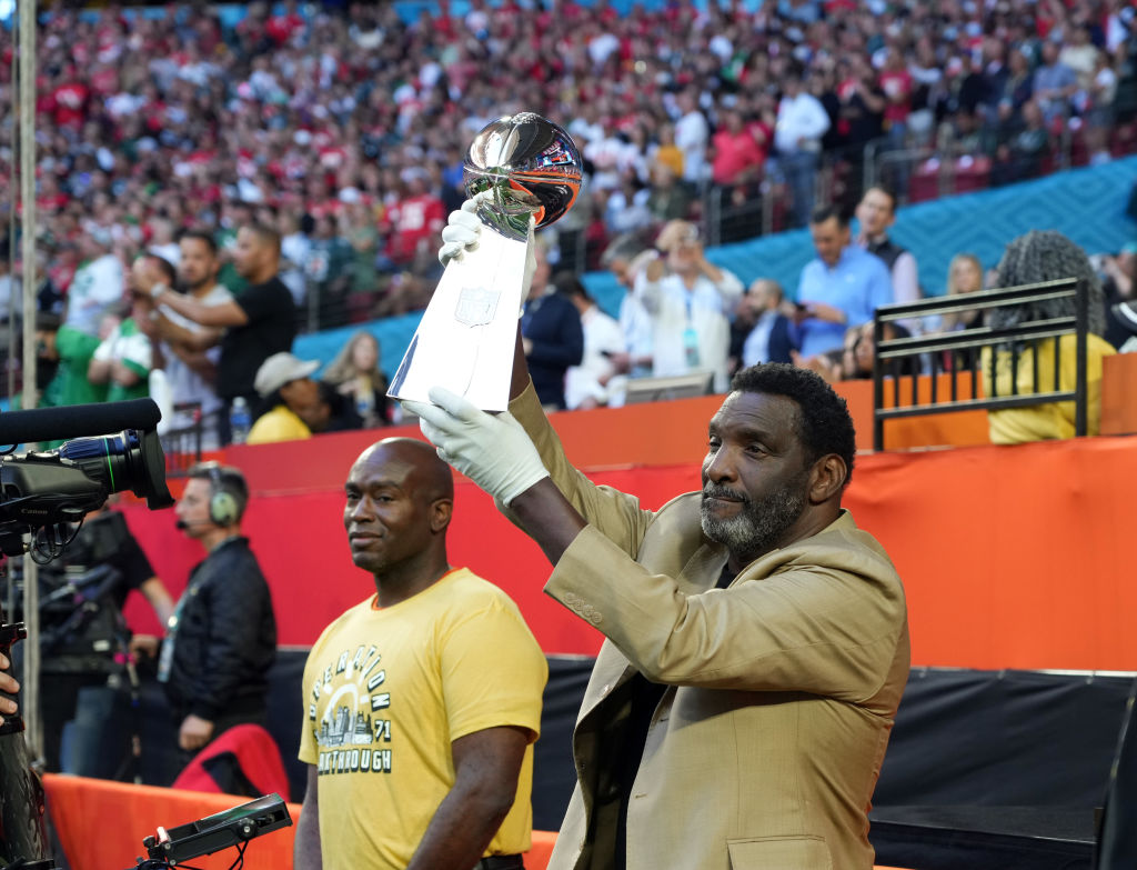 Doug Williams holding up the Lombardi trophy