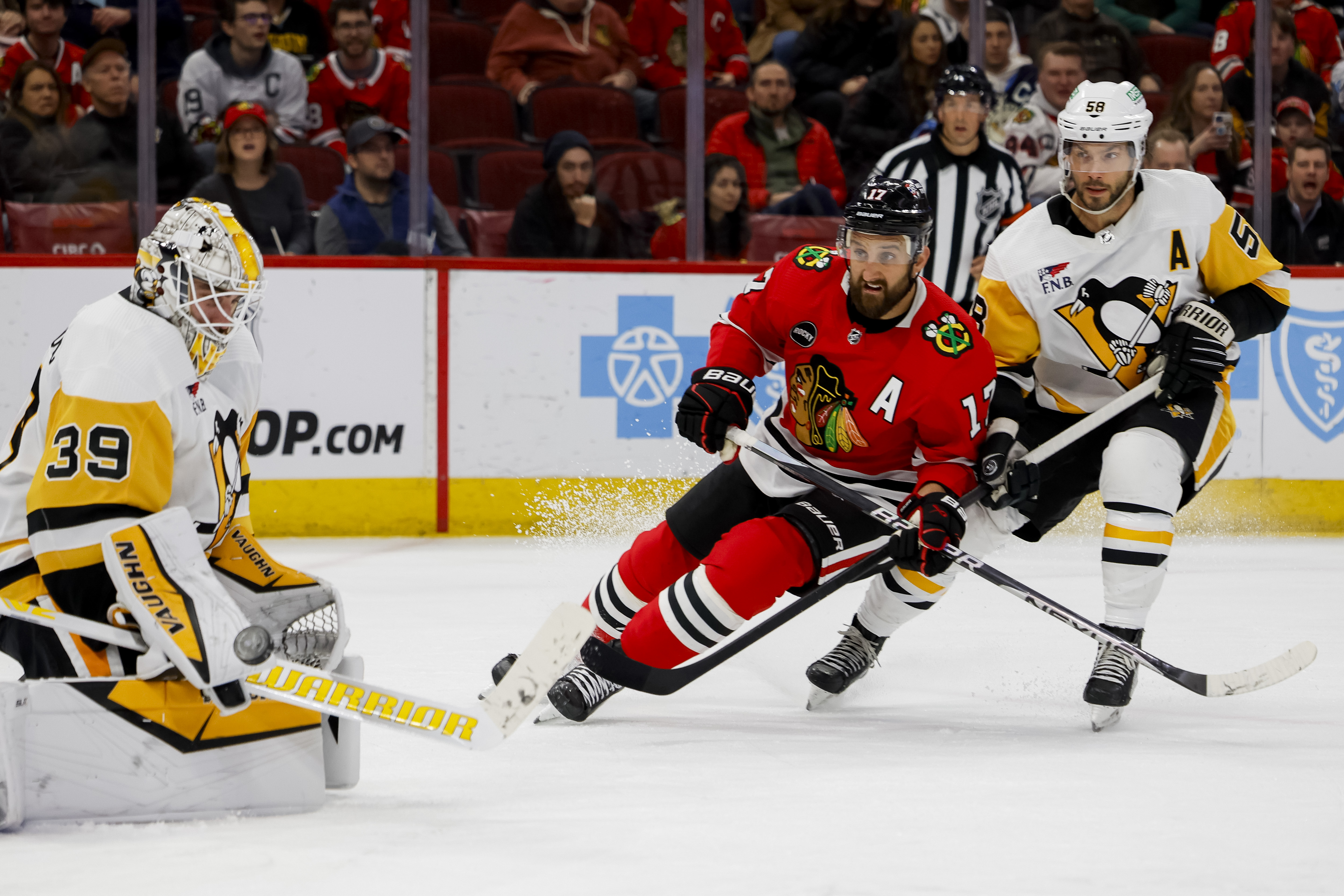 Blackhawks left wing Nick Foligno attempts a shot on goal against the Penguins on Feb. 15, 2024, at the United Center. (Vincent Alban/Chicago Tribune)