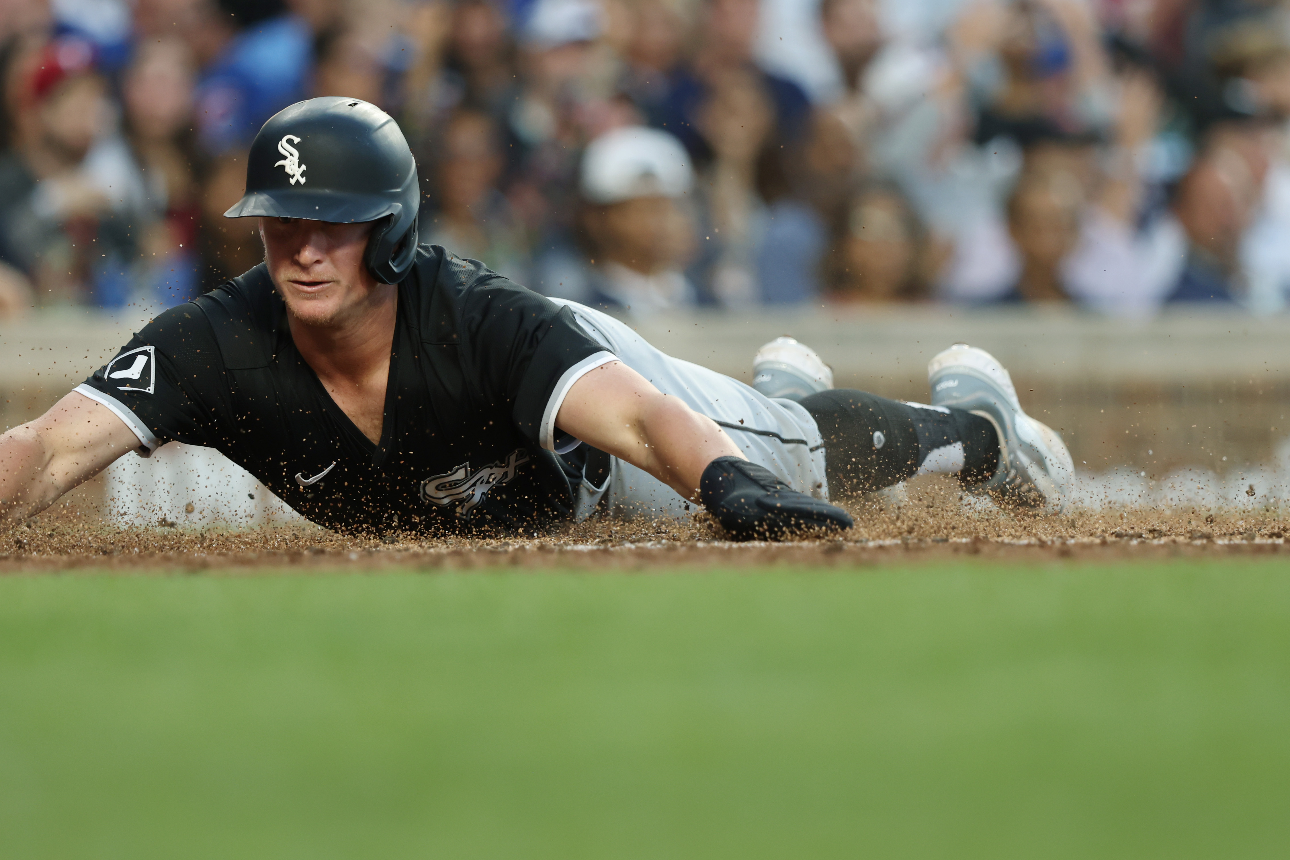 White Sox designated hitter Andrew Vaughn dives to the plate while scoring on a single from catcher Korey Lee in the fourth inning against the Cubs at Wrigley Field on June 5, 2024, in Chicago. (John J. Kim/Chicago Tribune)