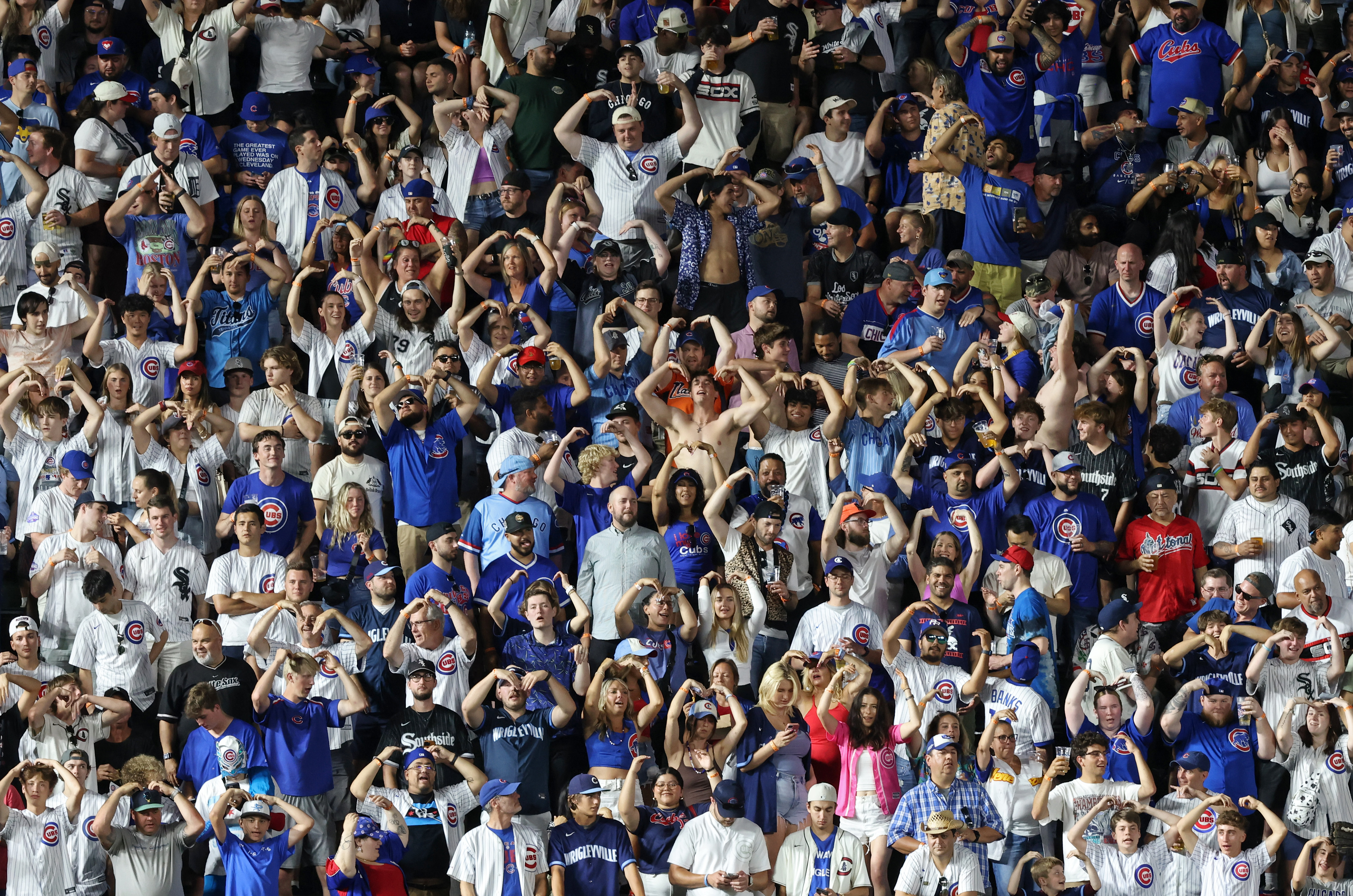 Fans sing and dance to "YMCA" during a White Sox pitching change in the seventh inning against the Cubs at Wrigley Field on June 5, 2024, in Chicago. (John J. Kim/Chicago Tribune)