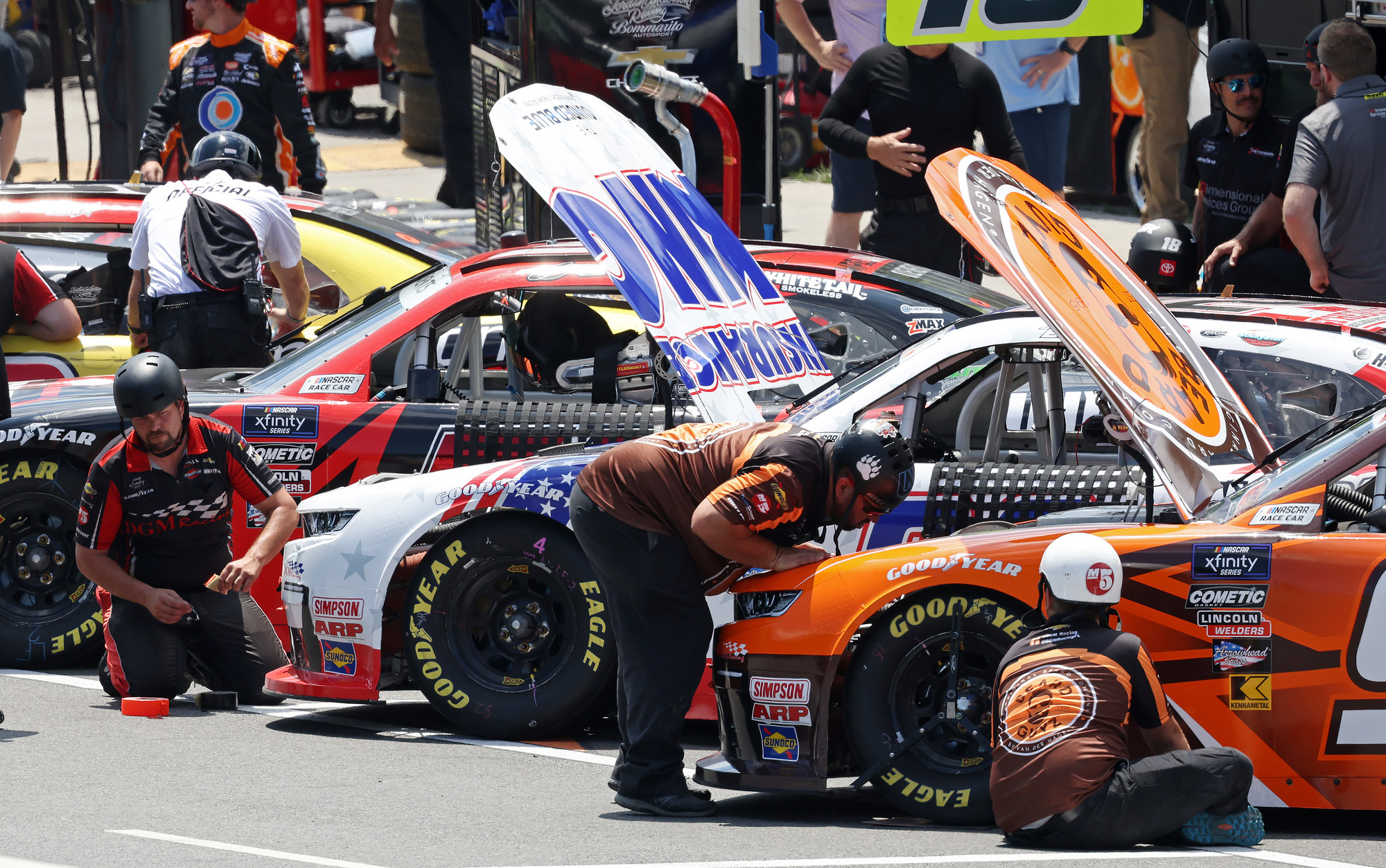 Crews work on their cars before the NASCAR Xfinity Series race Saturday, July 6, 2024, in Chicago. (John J. Kim/Chicago Tribune)