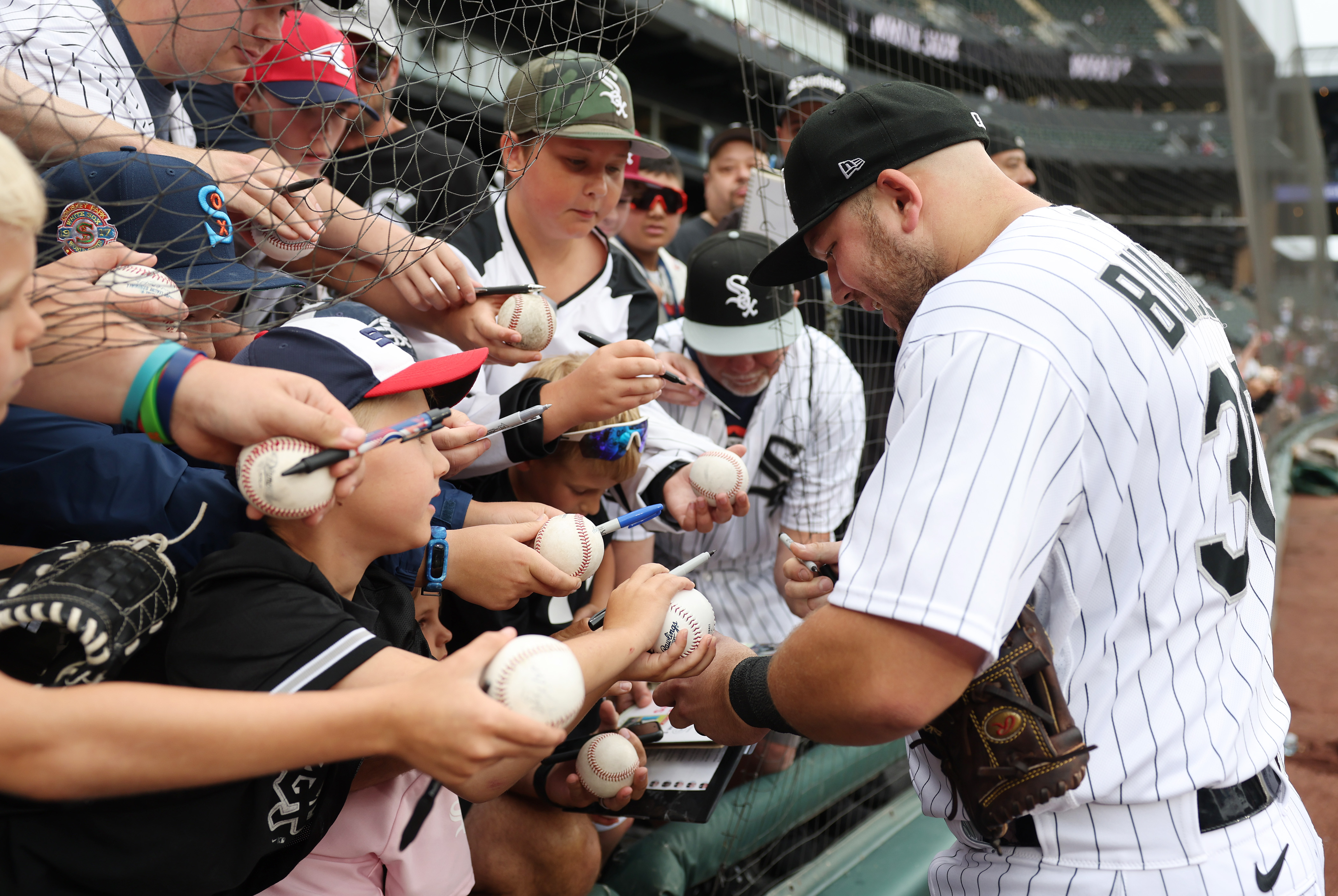 White Sox third baseman Jake Burger signs autographs before a game against the Cardinals at Guaranteed Rate Field on July 8, 2023. (John J. Kim/Chicago Tribune)