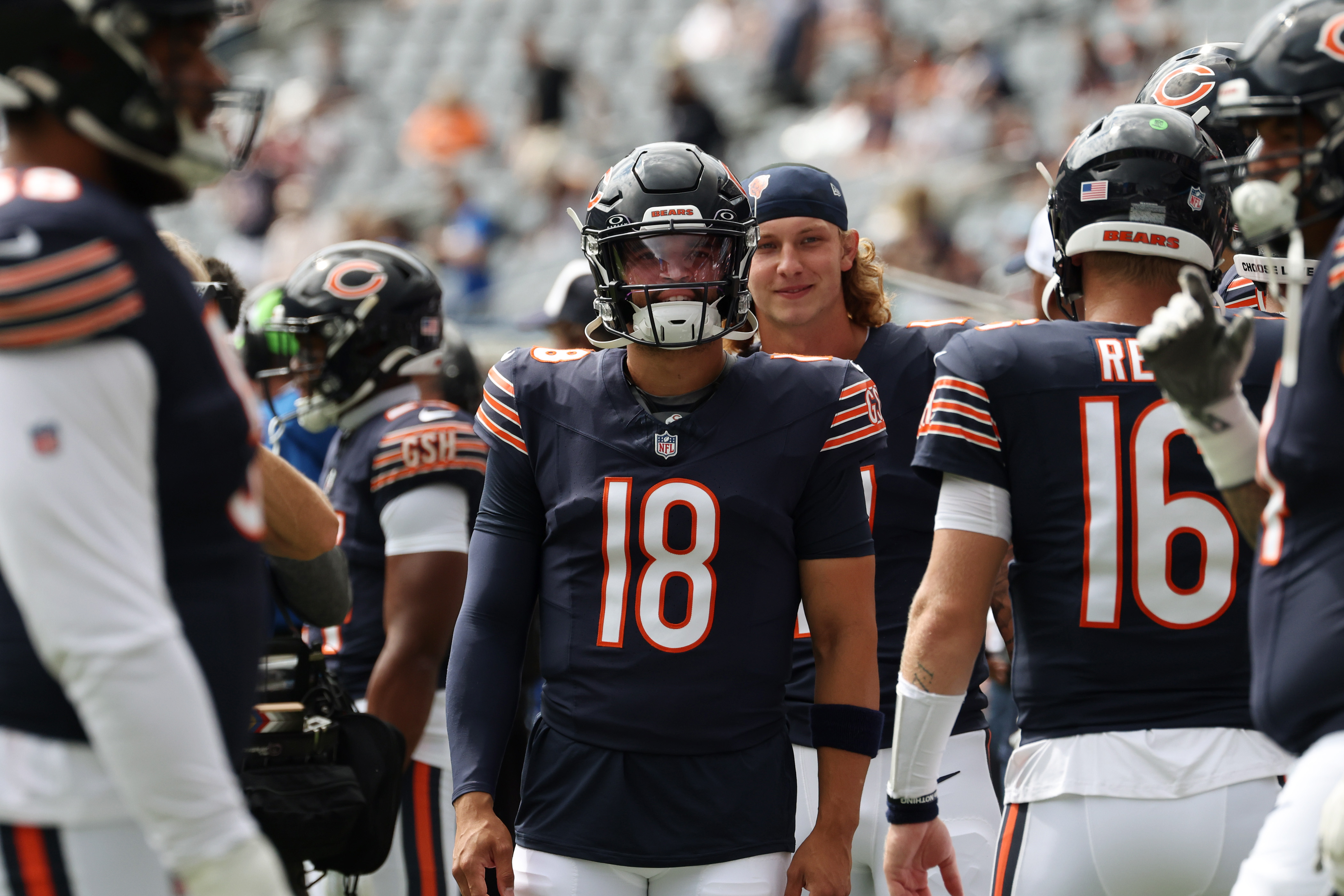 Bears quarterback Caleb Williams (18) and teammates warm up before a preseason game against the Bengals at Soldier Field on Aug. 17, 2024, in Chicago. (John J. Kim/Chicago Tribune)