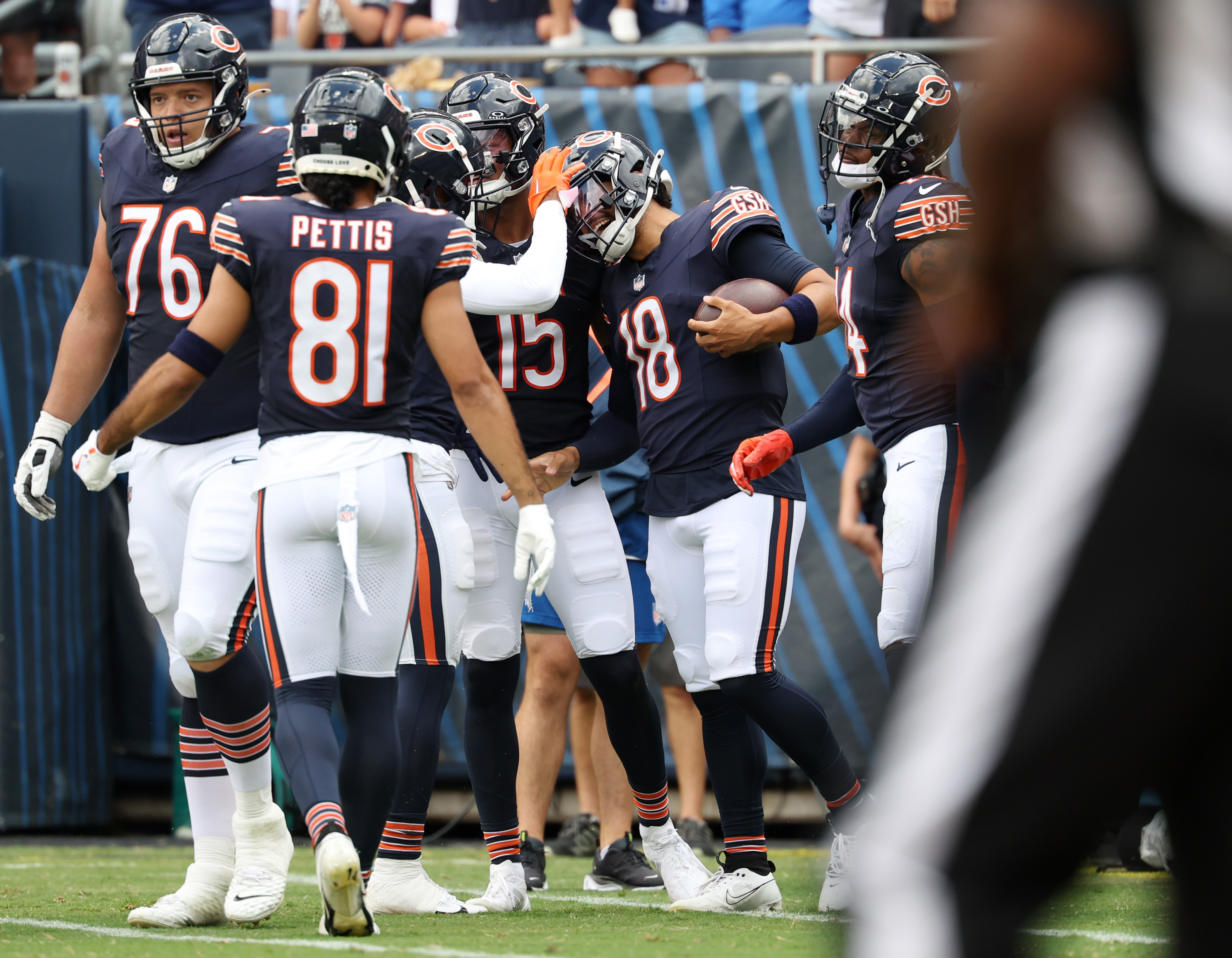 Bears quarterback Caleb Williams (18) celebrates with teammates after rushing for a touchdown in the second quarter against the Bengals in a preseason game at Soldier Field on Aug. 17, 2024, in Chicago. (John J. Kim/Chicago Tribune)