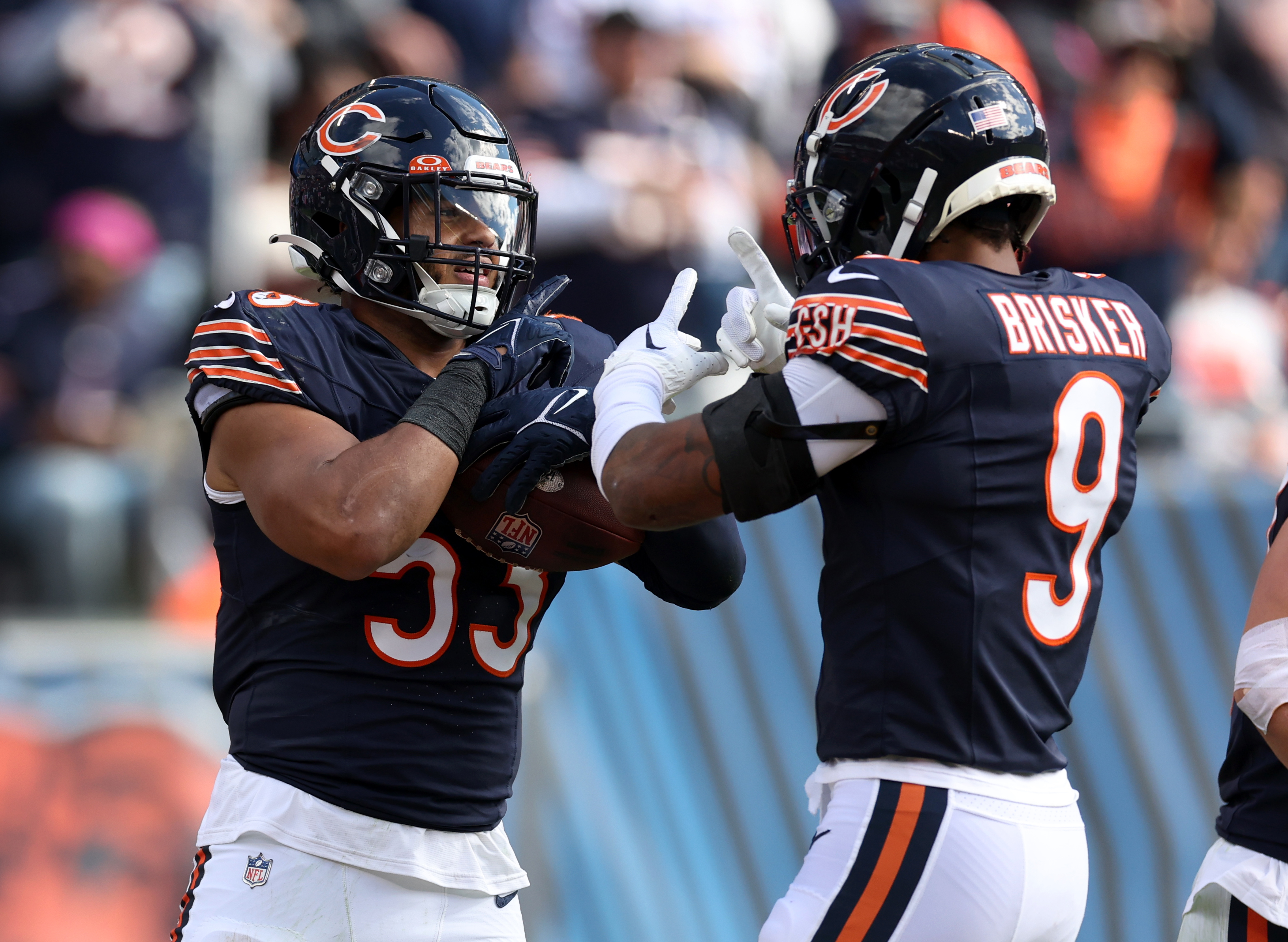 Bears linebacker T.J. Edwards (53) celebrates with safety Jaquan Brisker (9) after Edwards thought he recovered a fumble against the Vikings on Oct. 15, 2023, at Soldier Field. Officials determined Edwards was out of bounds. (Chris Sweda/Chicago Tribune)