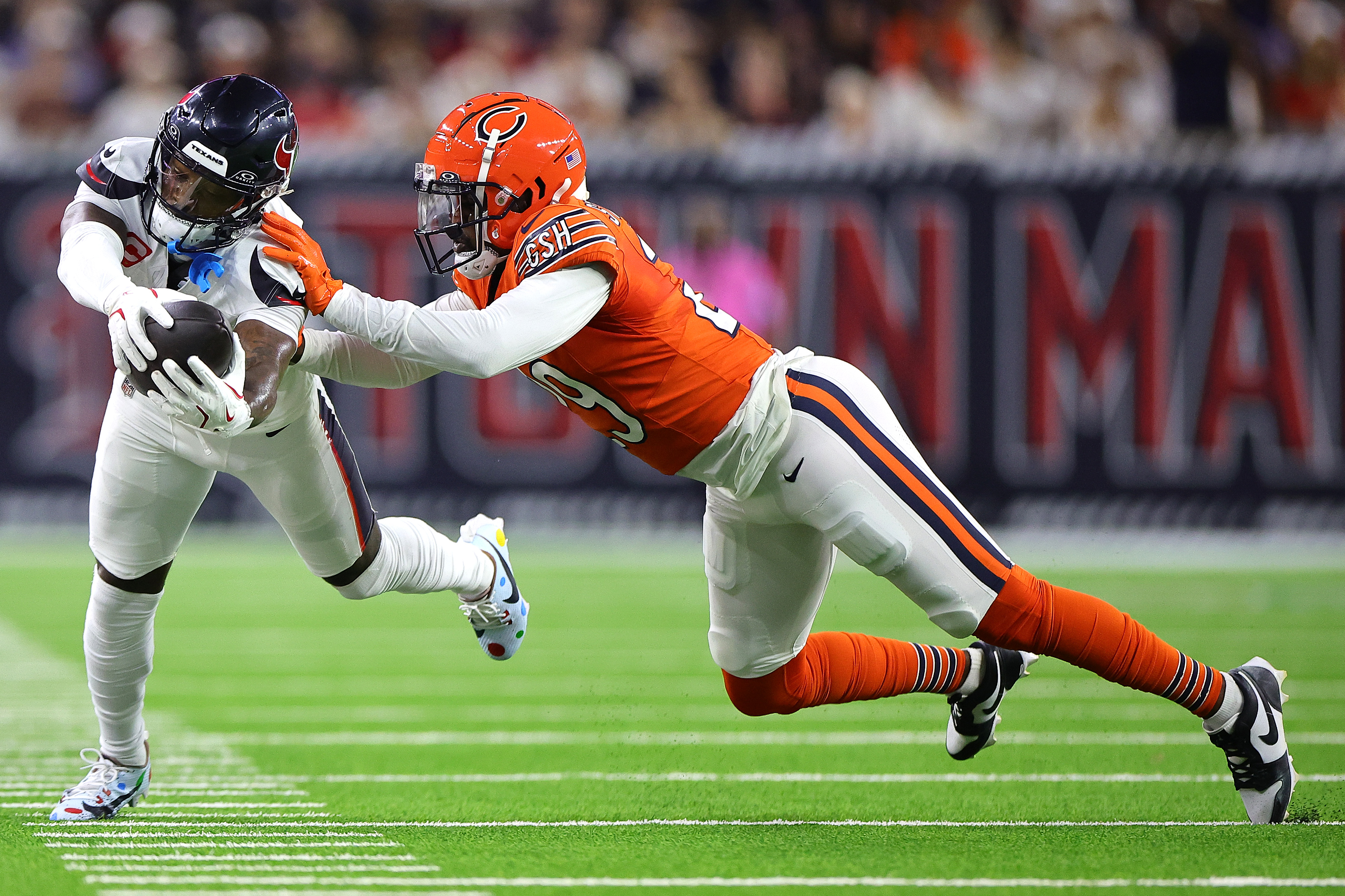 The Texans' Stefon Diggs dives with the ball against the Bears' Tyrique Stevenson during the second quarter at NRG Stadium on Sept. 15, 2024, in Houston. (Alex Slitz/Getty Images)