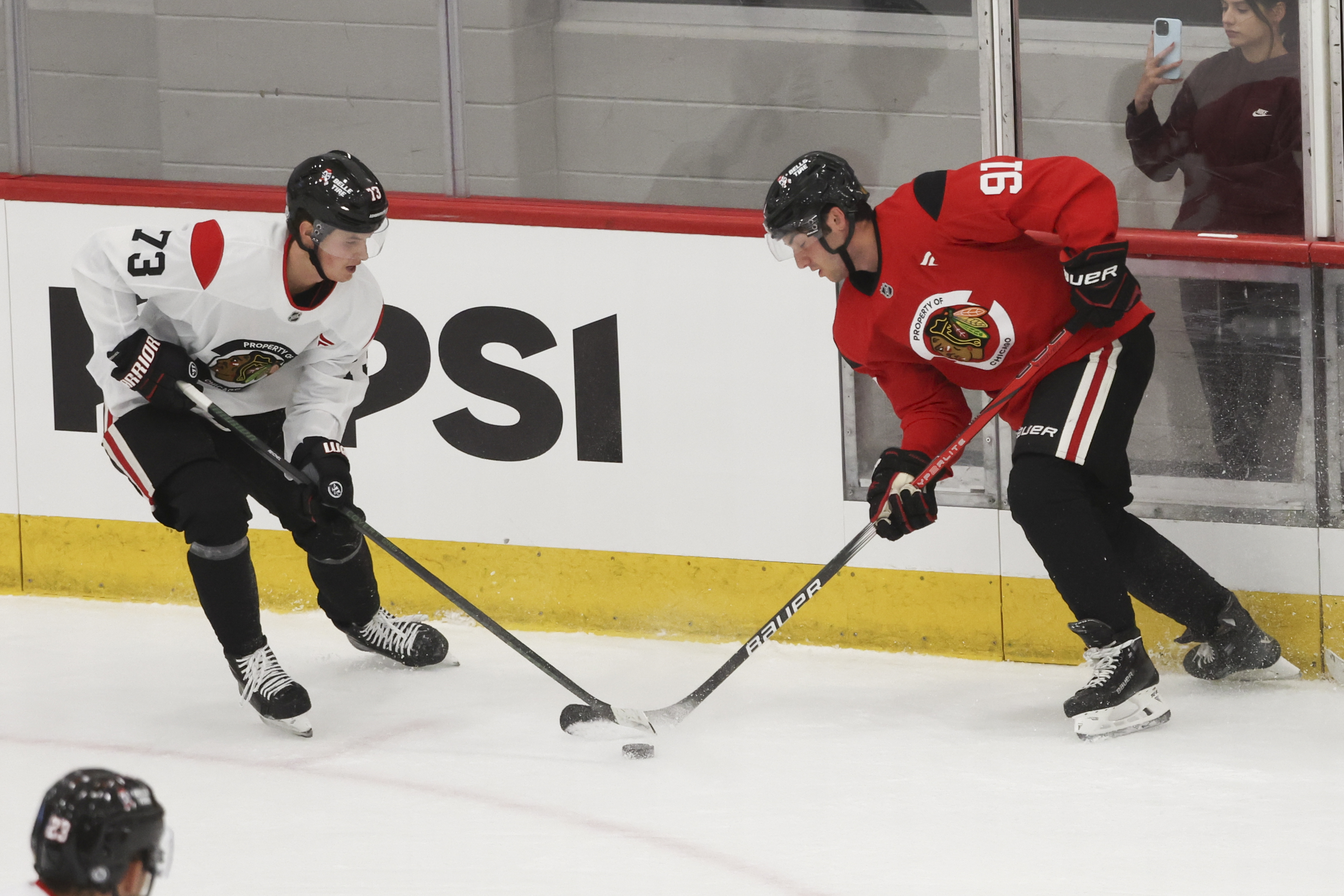 Chicago Blackhawks forward Lukas Reichel (73) and prospect Frank Nazar battle for the puck during the first day of training camp at Fifth Third Arena on Thursday, Sept. 19, 2024. (Eileen T. Meslar/Chicago Tribune)