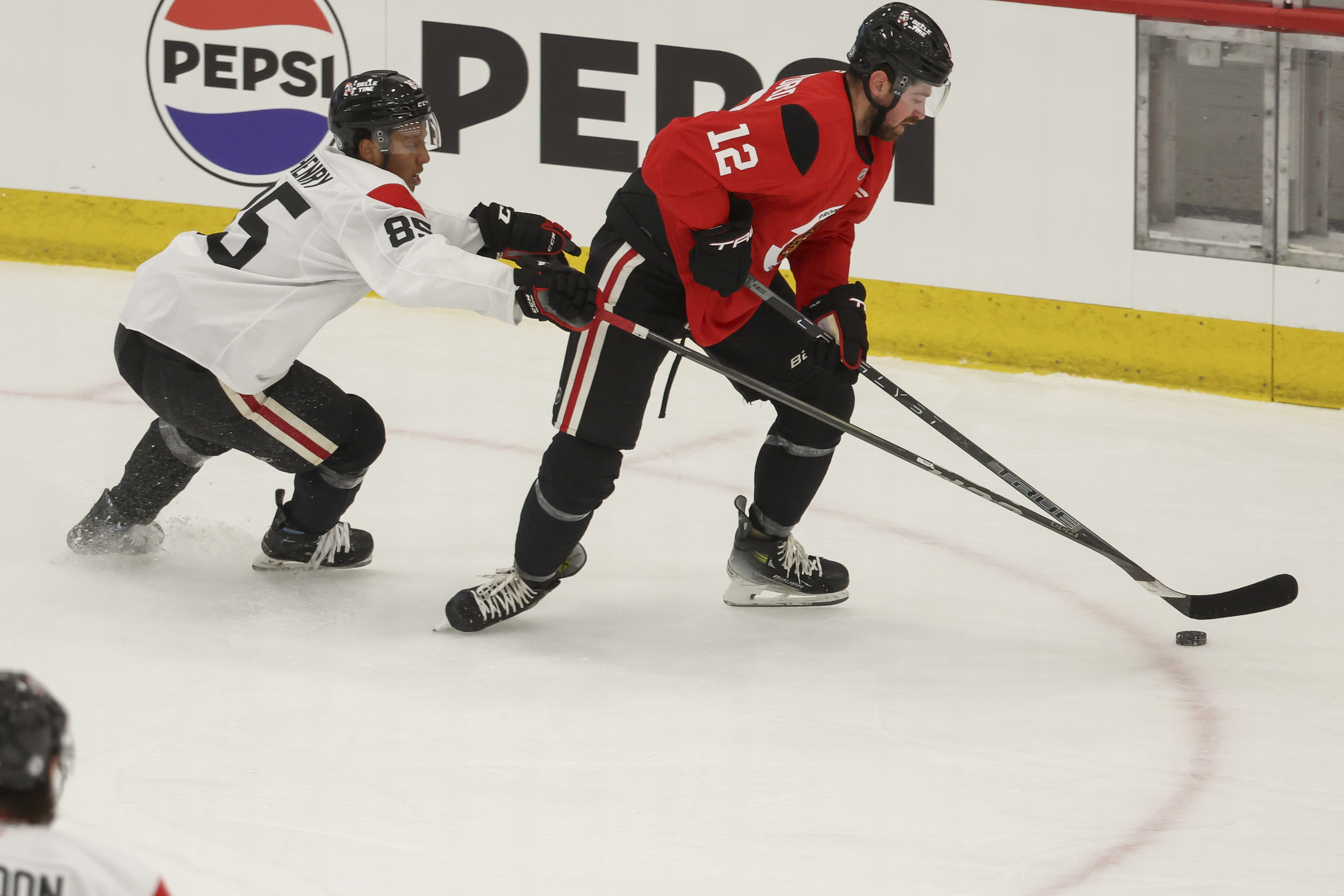 Chicago Blackhawks prospect Ty Henry (85) battles forward Zachary Sanford (12) for the puck during the first day of training camp at Fifth Third Arena on Thursday, Sept. 19, 2024. (Eileen T. Meslar/Chicago Tribune)