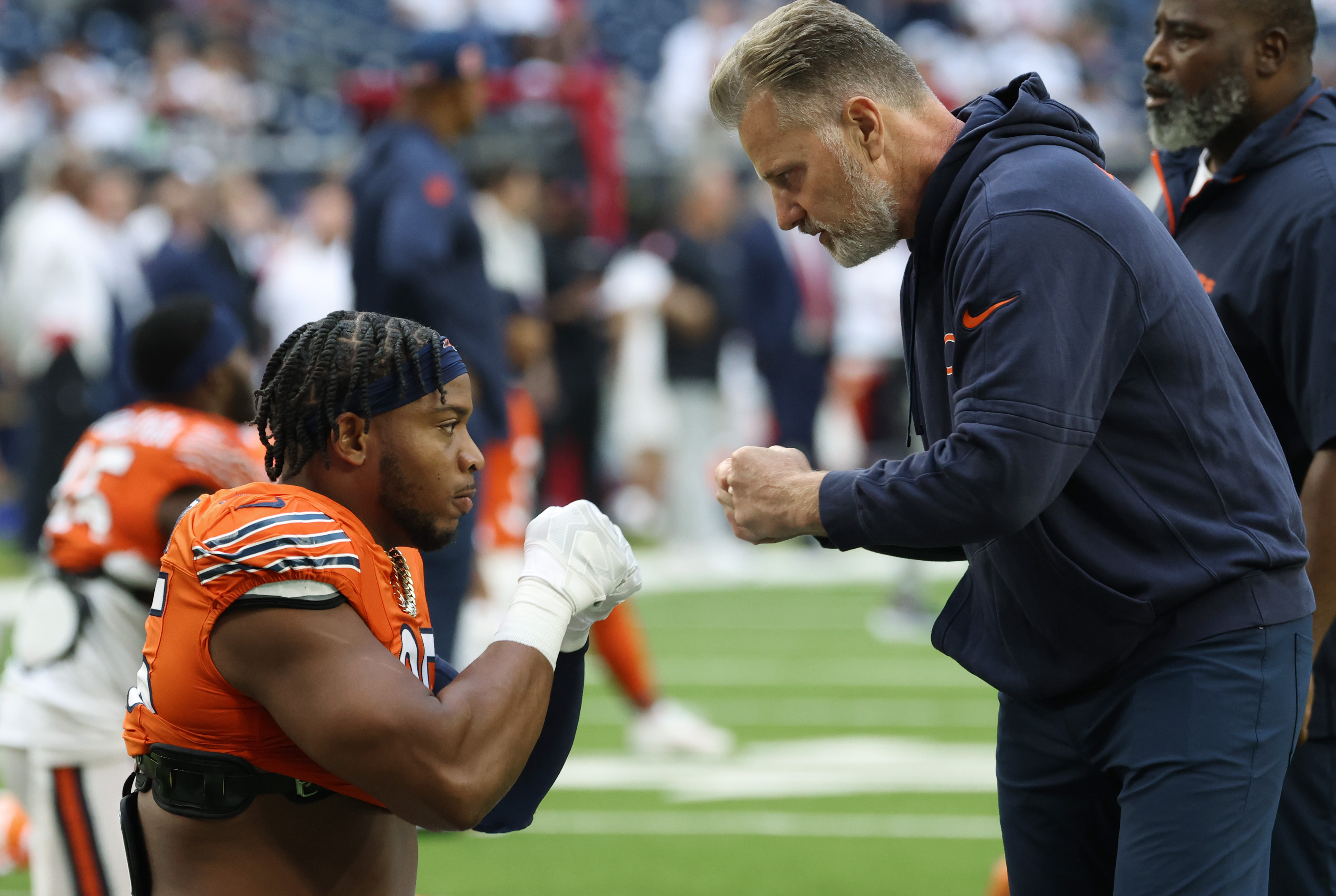 Bears defensive end DeMarcus Walker gets first bumps from head coach Matt Eberflus before a game against the Texans at NRG Stadium on Sept. 15, 2024, in Houston. (John J. Kim/Chicago Tribune)