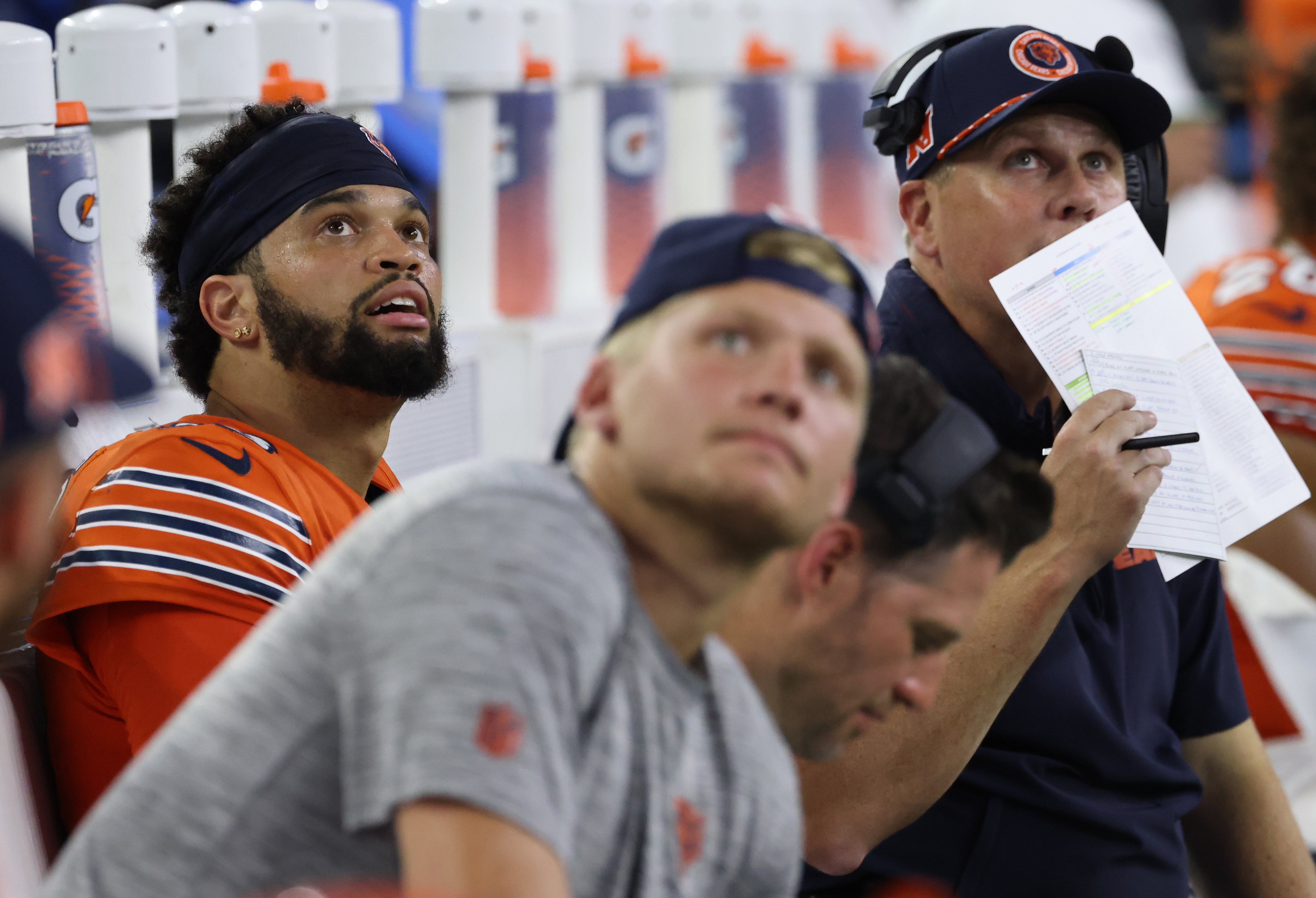 Bears quarterback Caleb Williams (18), left, sits on the bench with offensive coordinator Shane Waldron, right, after throwing an interception against the Texans in the fourth quarter at NRG Stadium on Sept. 15, 2024, in Houston. (John J. Kim/Chicago Tribune)