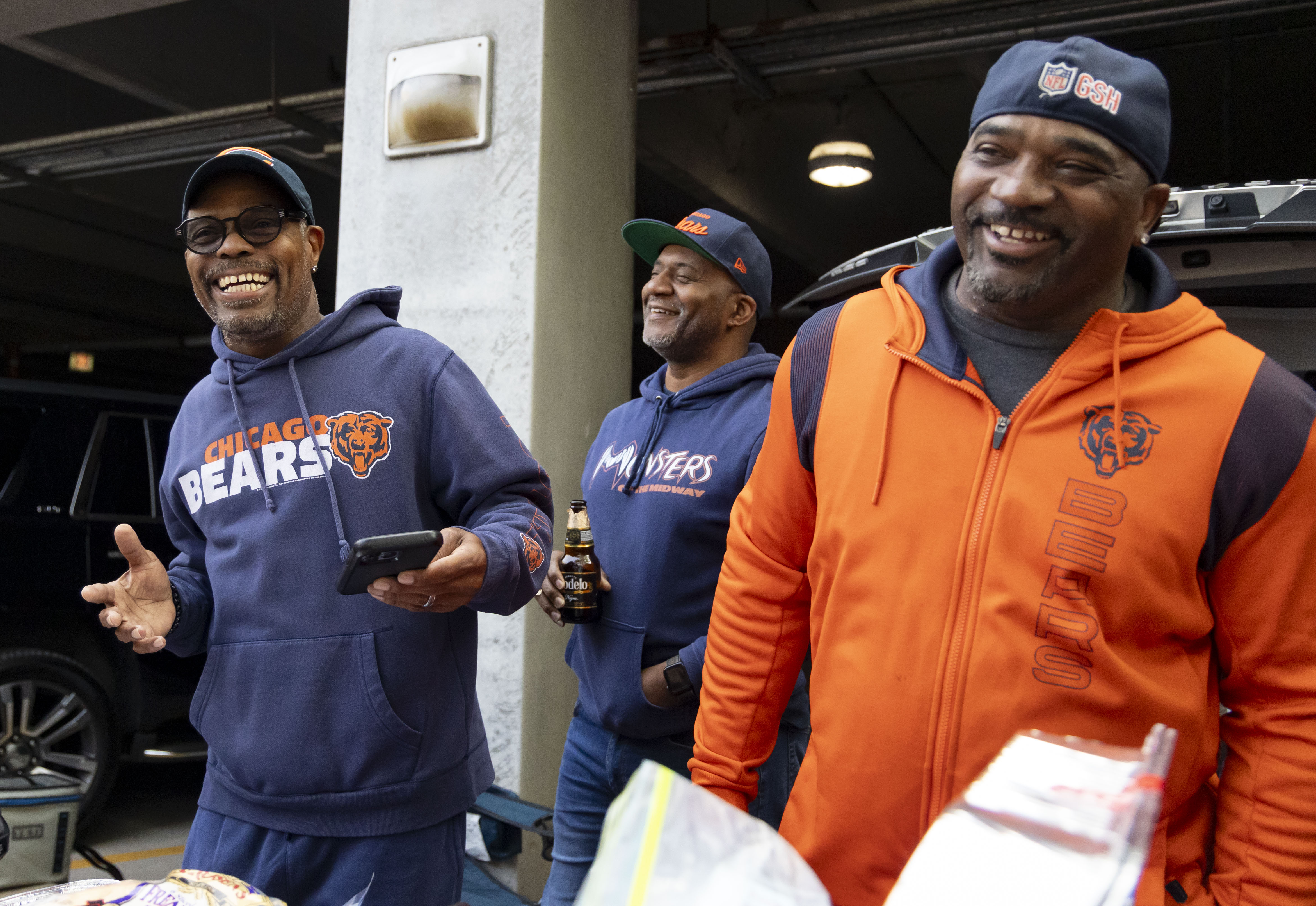 Friends Jaye Beasley, Bruce Davis and Ed Fairchild tailgate together before the Chicago Bears face the Tennessee Titans in the season opener on Sunday, Sept. 8, 2024, at Soldier Field. (Brian Cassella/Chicago Tribune)a