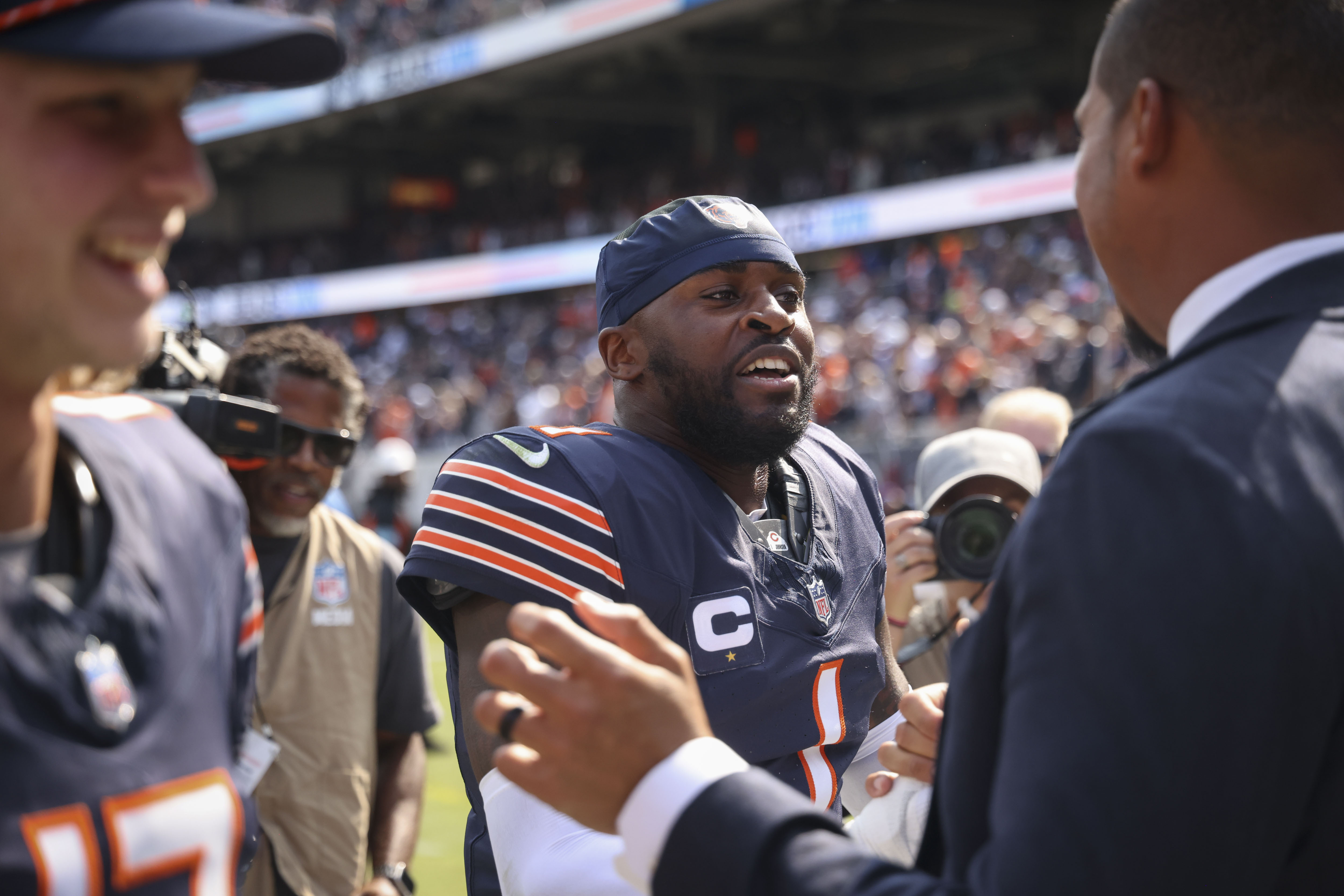 Chicago Bears cornerback Jaylon Johnson, 1, celebrates the win with gemeral manager Ryan Poles on Sunday, Sept. 8, 2024, at Soldier Field. The Bears defeated the Titans 24-17. (Brian Cassella/Chicago Tribune)