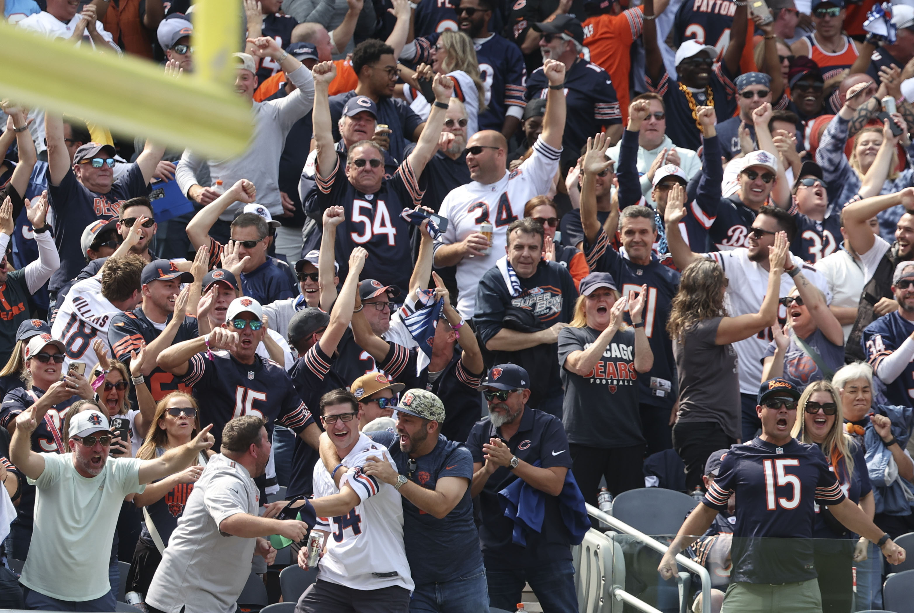 Chicago Bears fans celebrate as the team scores a touchdown on a blocked punt in the third quarter Sunday, Sept. 8, 2024, at Soldier Field. The Bears defeated the Titans 24-17. (Brian Cassella/Chicago Tribune)