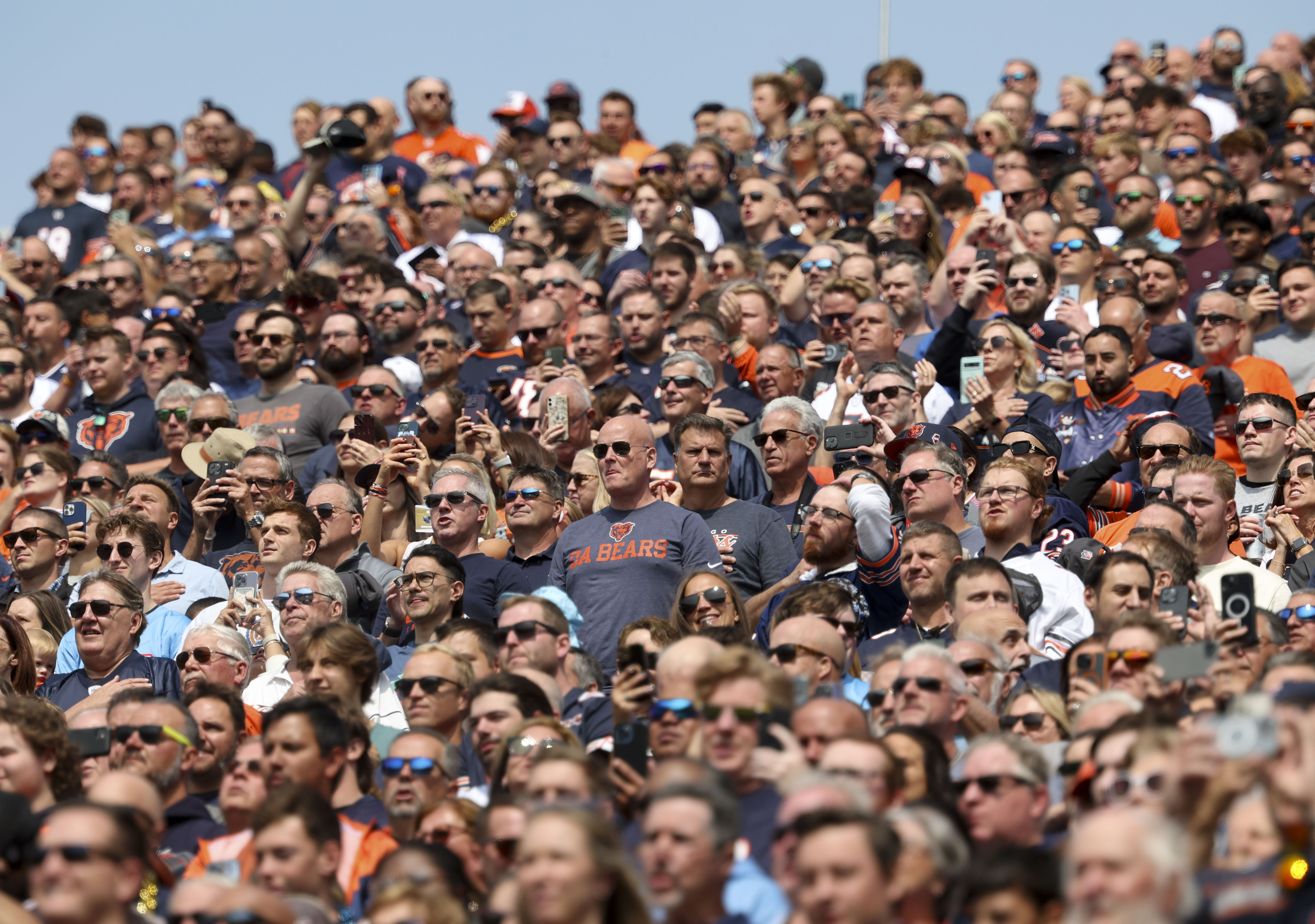 Chicago Bears fans stand during the national anthem on Sunday, Sept. 8, 2024, at Soldier Field. (Brian Cassella/Chicago Tribune)