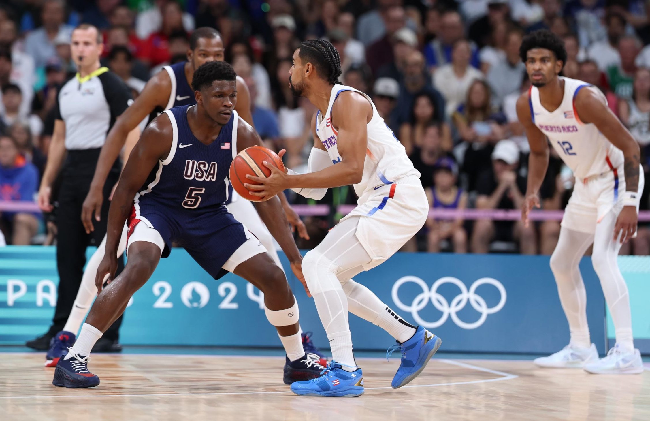 Puerto Rico's Gian Clavell is defended by Team USA's Anthony Edwards (5) during the 2024 Paris Olympics while wearing Stria shoes, a company founded by Deerfield's Eric Porter. (Peter Backus/Handout)