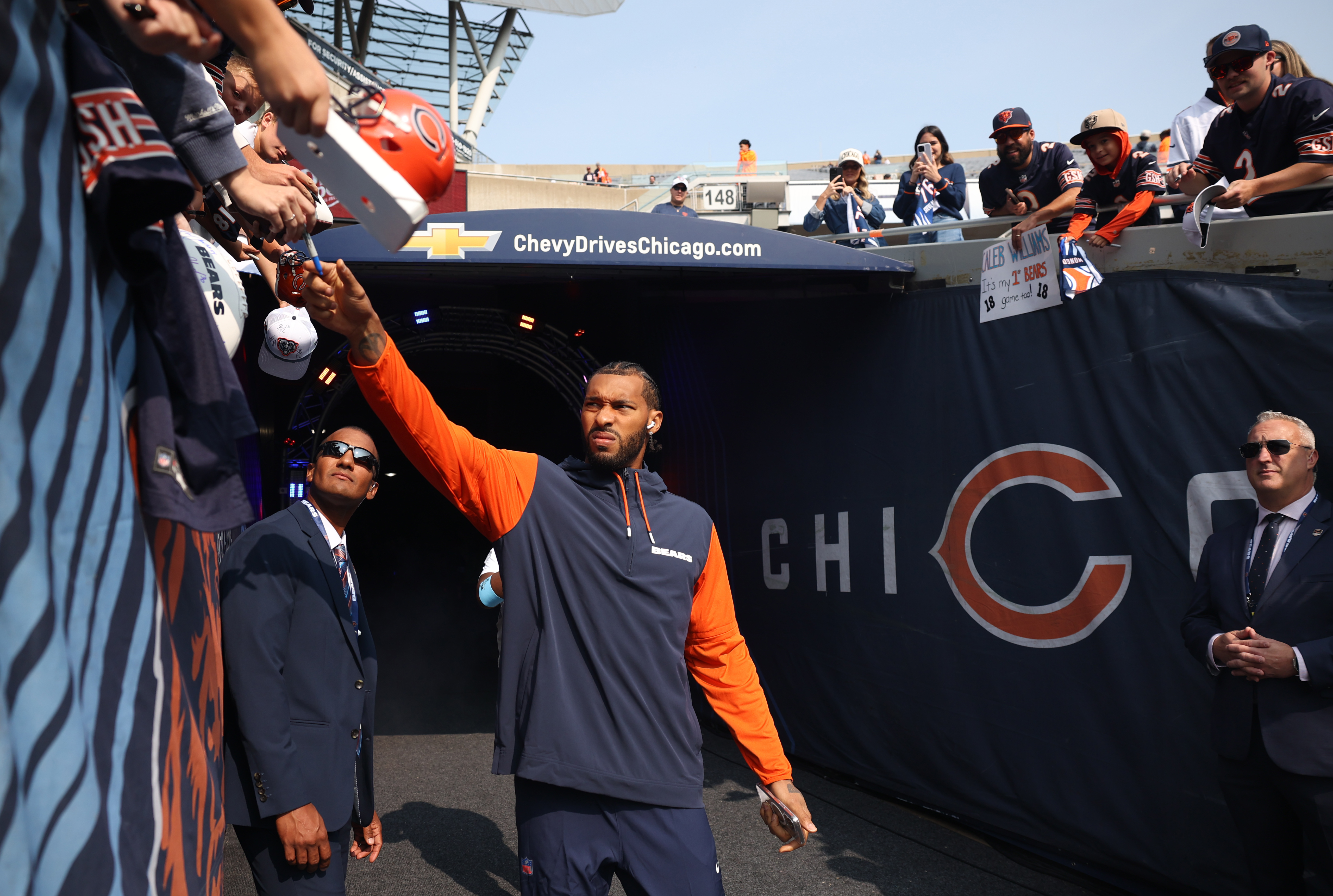 Chicago Bears defensive end Montez Sweat grabs a pen before signing a few autographs before a game against the Tennessee Titans at Soldier Field in Chicago on Sept. 8, 2024. (Chris Sweda/Chicago Tribune)