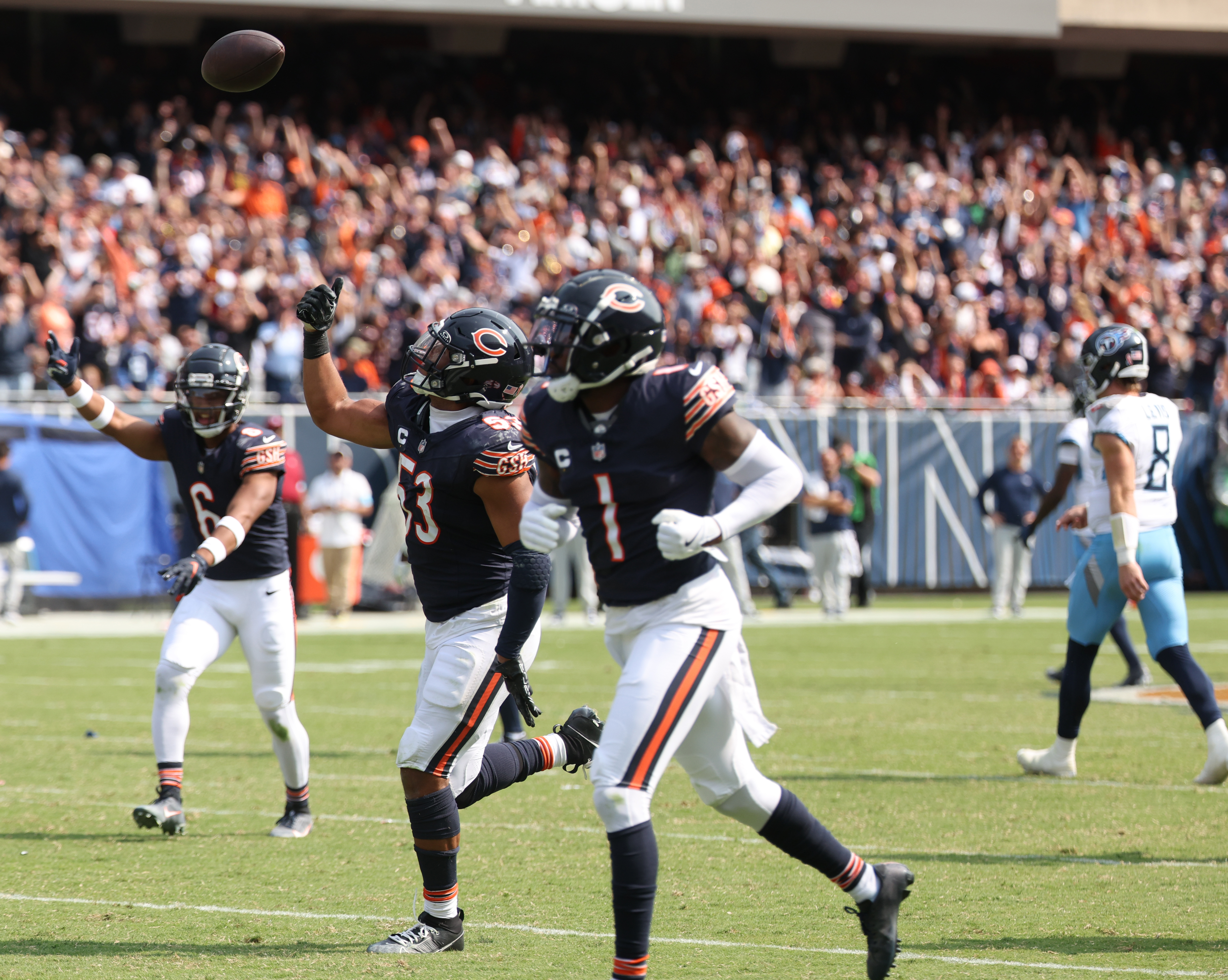 Chicago Bears linebacker T.J. Edwards, 53, throws the ball in the air after recovering a fumble in the fourth quarter of a game against the Tennessee Titans at Soldier Field. (Chris Sweda/Chicago Tribune)