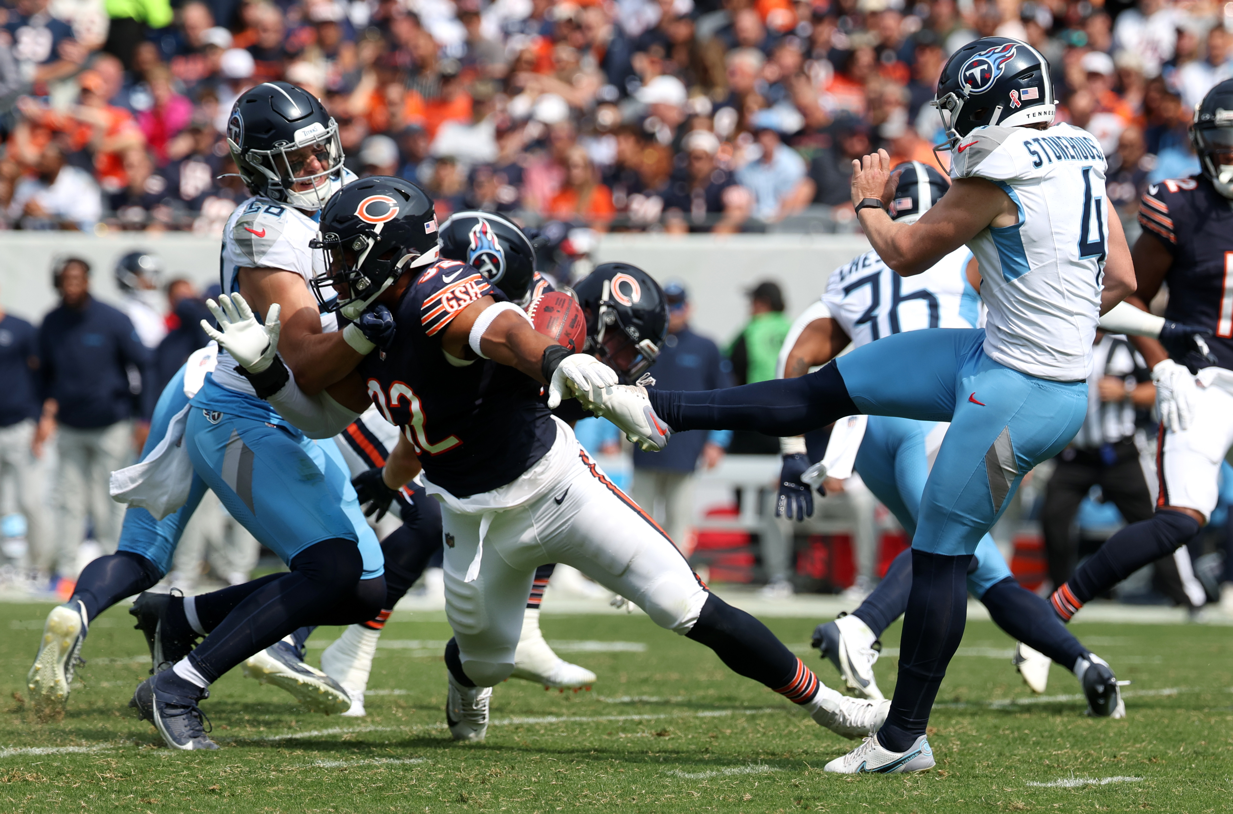 Tennessee Titans punter Ryan Stonehouse, 4, has his punt blocked by Chicago Bears defensive end Daniel Hardy, 92, in the third quarter of a game at Soldier Field on Sunday. Chicago Bears safety Jonathan Owens, 36, returned the ball for the touchdown. (Chris Sweda/Chicago Tribune)