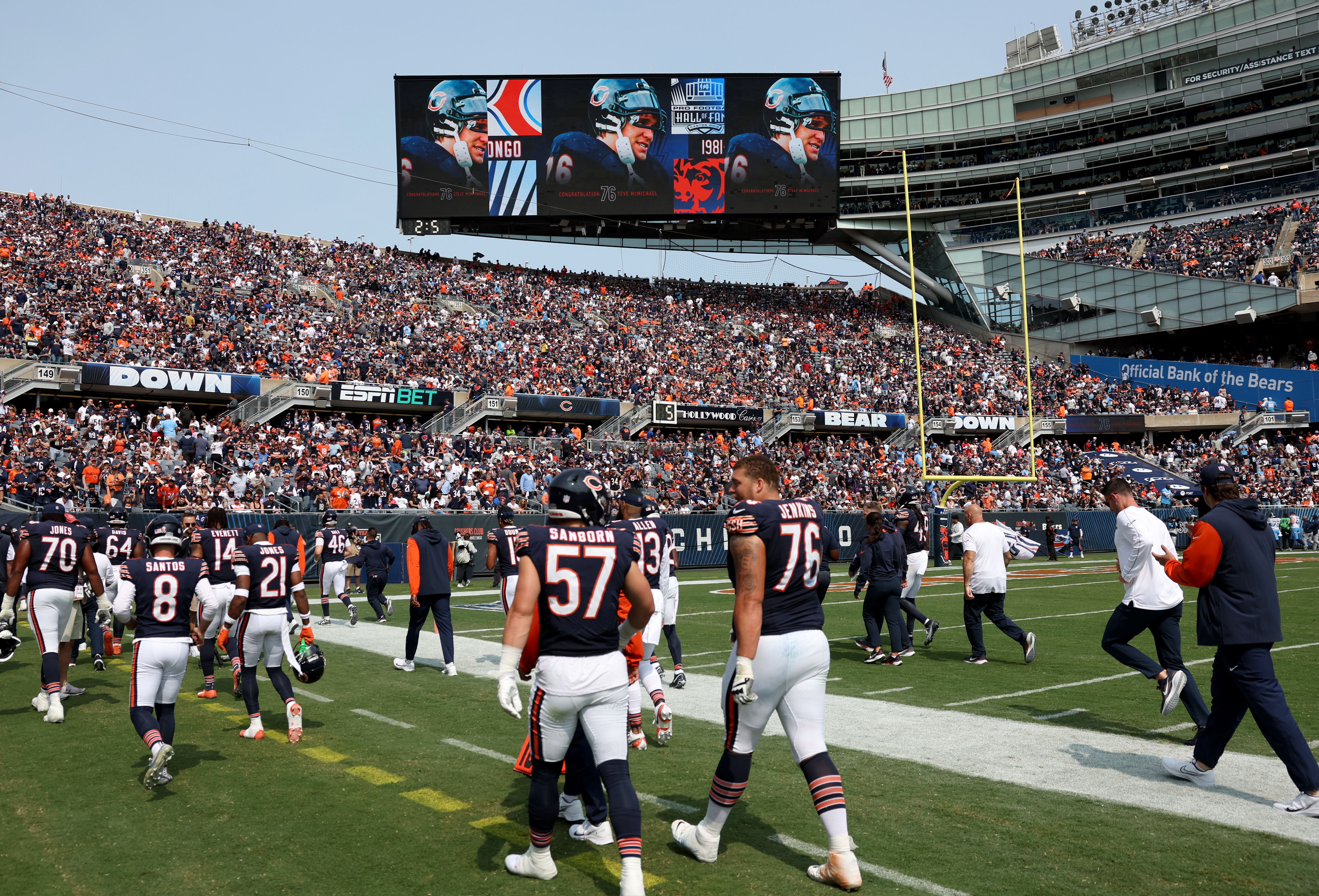 The big screen shows images of Chicago Bears great Steve McMichael as players head to the locker room at halftime of a game against the Tennessee Titans at Soldier Field in Chicago on Sept. 8, 2024. (Chris Sweda/Chicago Tribune)