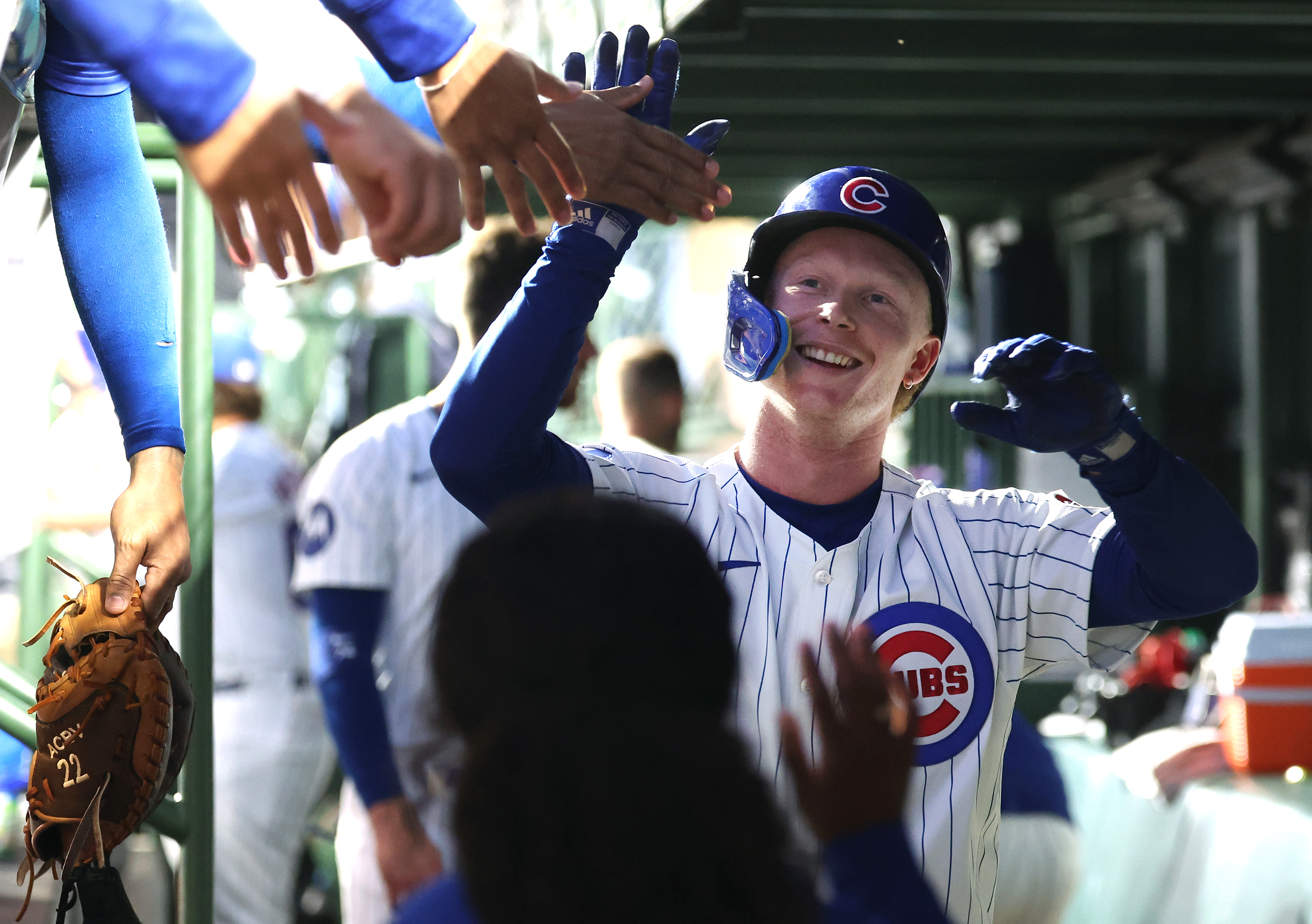 Cubs center fielder Pete Crow-Armstrong is congratulated in the dugout after hitting a solo home run in the third inning against the Pirates on Sept. 4, 2024, at Wrigley Field. (Chris Sweda/Chicago Tribune)