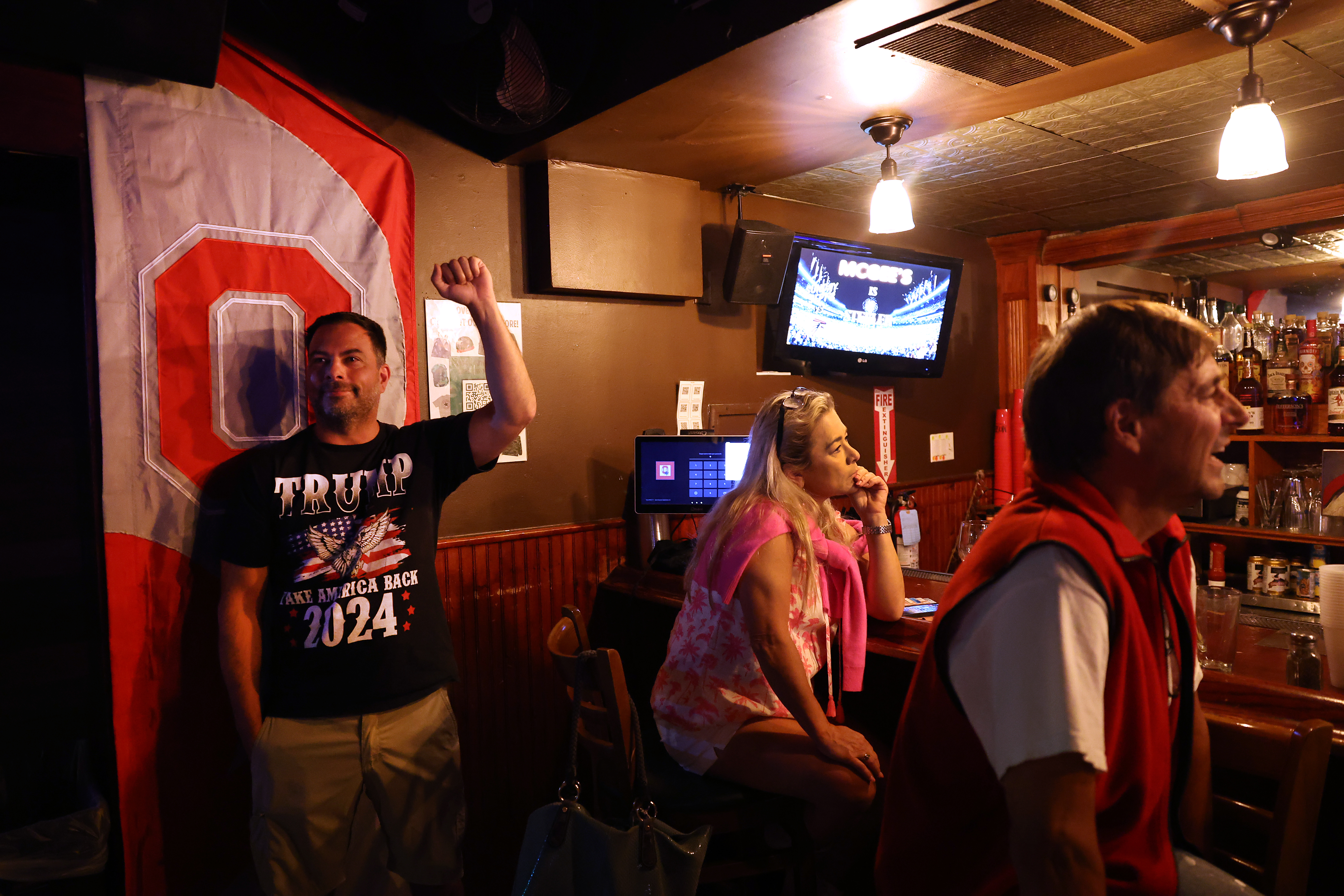 Nate Carrera, left, reacts while attending a watch party hosted by Chicago Young Republicans at McGee's Tavern in Chicago's Lincoln Park neighborhood during a presidential debate between Donald Trump and Kamala Harris on Tuesday, Sept. 10, 2024. (Chris Sweda/Chicago Tribune)