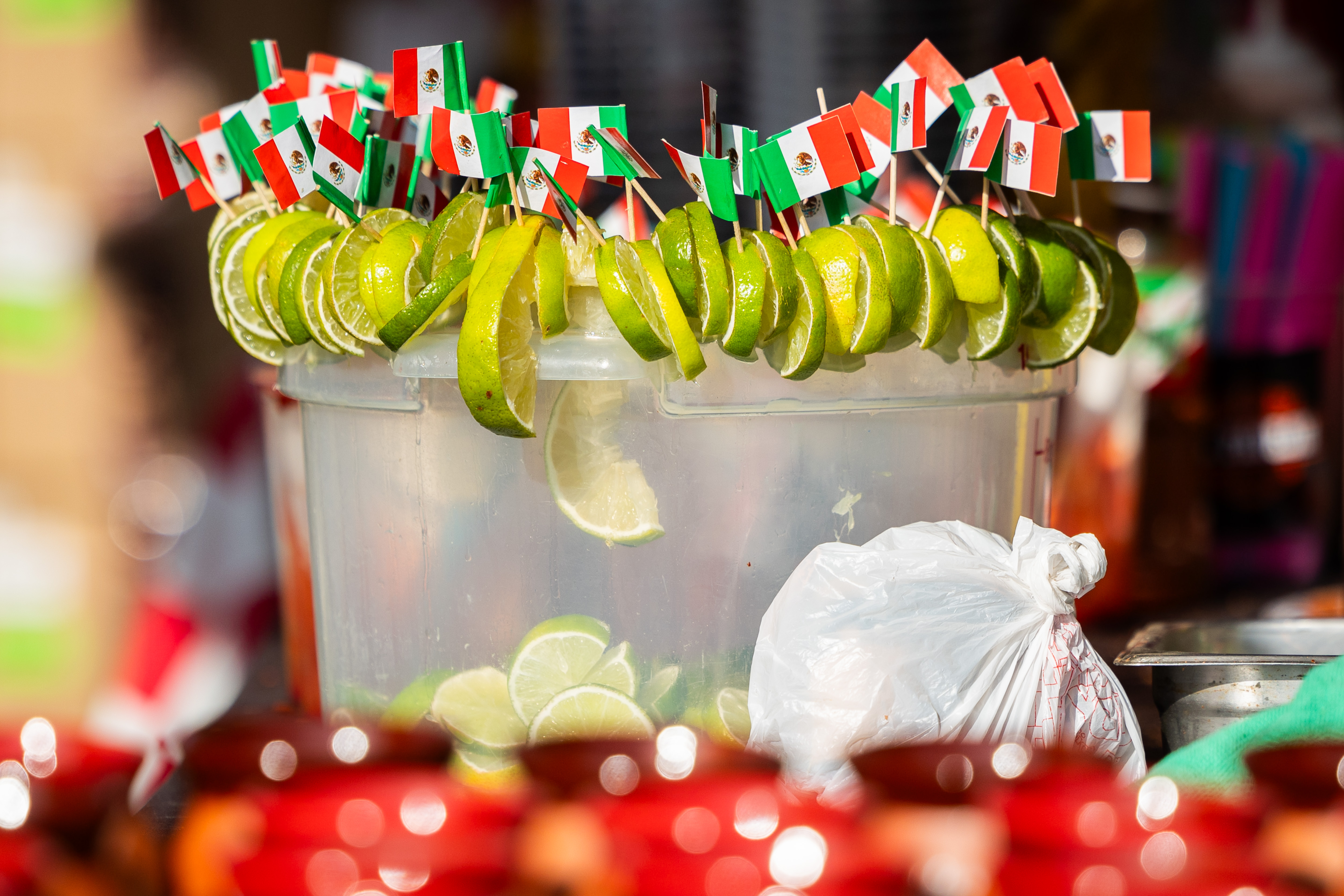 Limes with the Mexican flag are displayed at stand selling micheladas at El Grito Chicago, a two-day festival in celebration of Mexican Independence Day, at Grant Park's Butler Field in Chicago on Sept. 14, 2024. (Tess Crowley/Chicago Tribune)