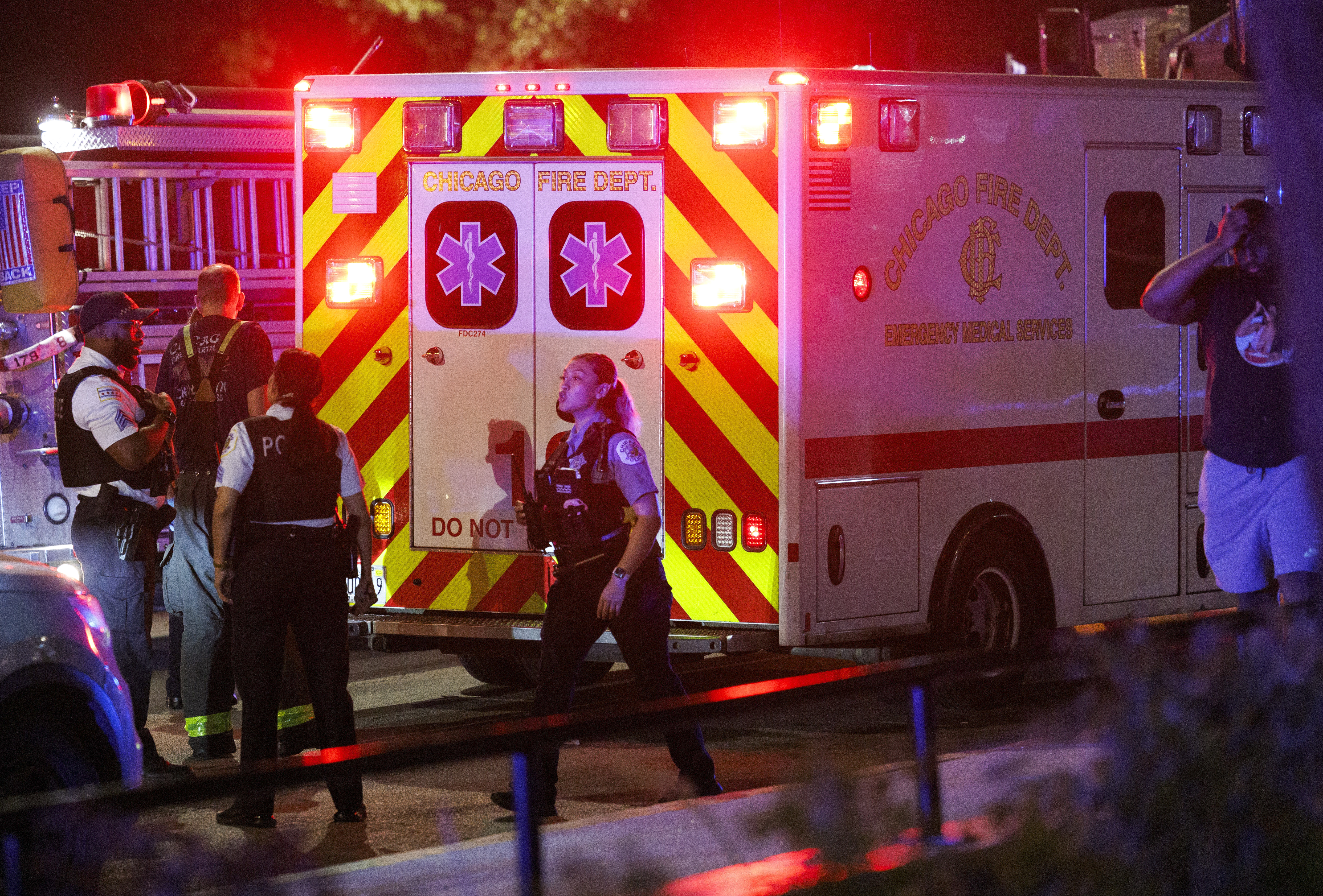 An ambulance transports a person at the scene where a 26-year-old man was fatally shot and a 25-year-old woman was shot on the 100 block of East 21st Street in the Near South Side neighborhood on Saturday, July 6, 2024, in Chicago. (Armando L. Sanchez/Chicago Tribune)