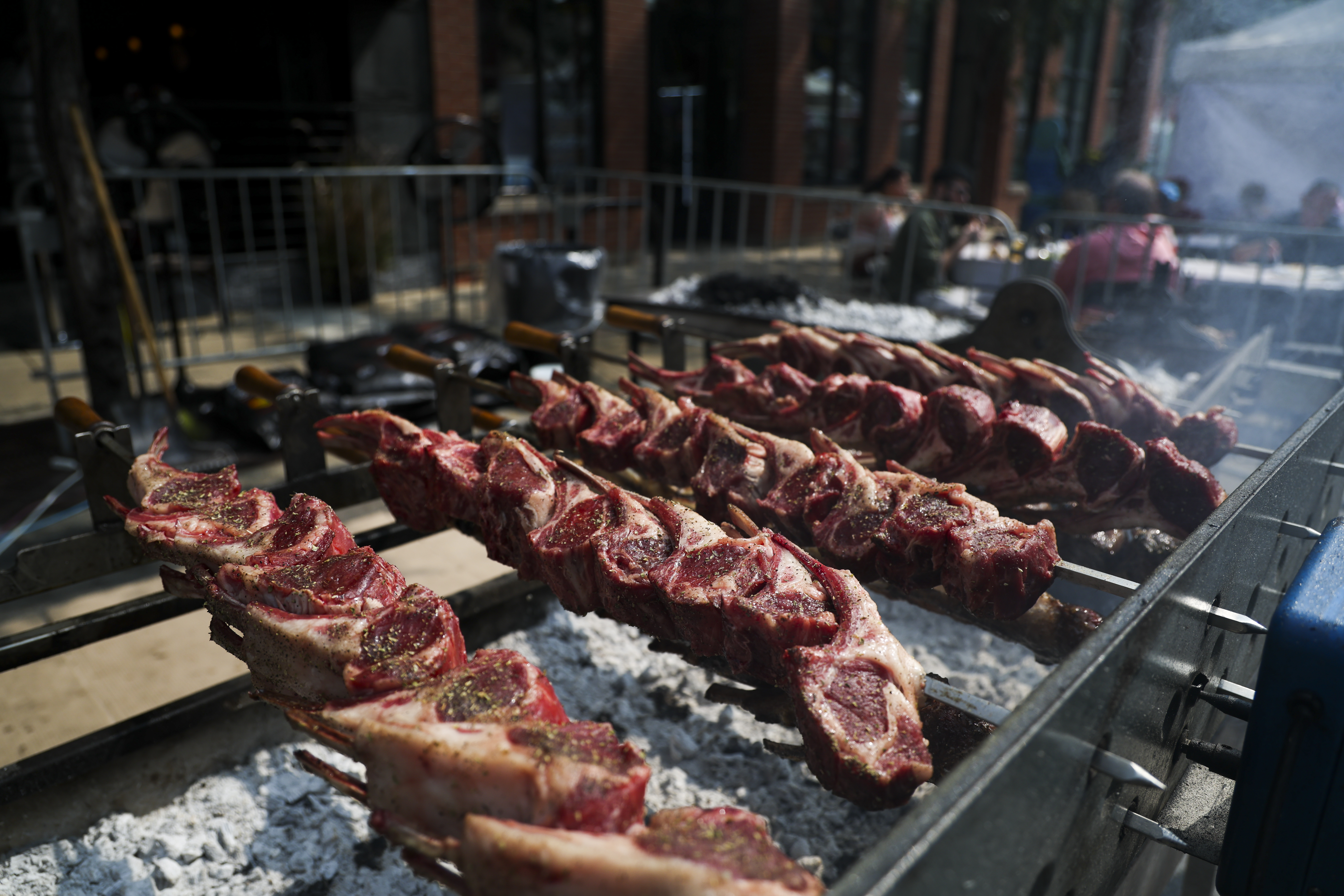 Lamb chops cook at the Spectrum Bar & Grill tent during Taste of Greektown in the Greektown neighborhood on Sunday, Sept. 8, 2024. (Eileen T. Meslar/Chicago Tribune)