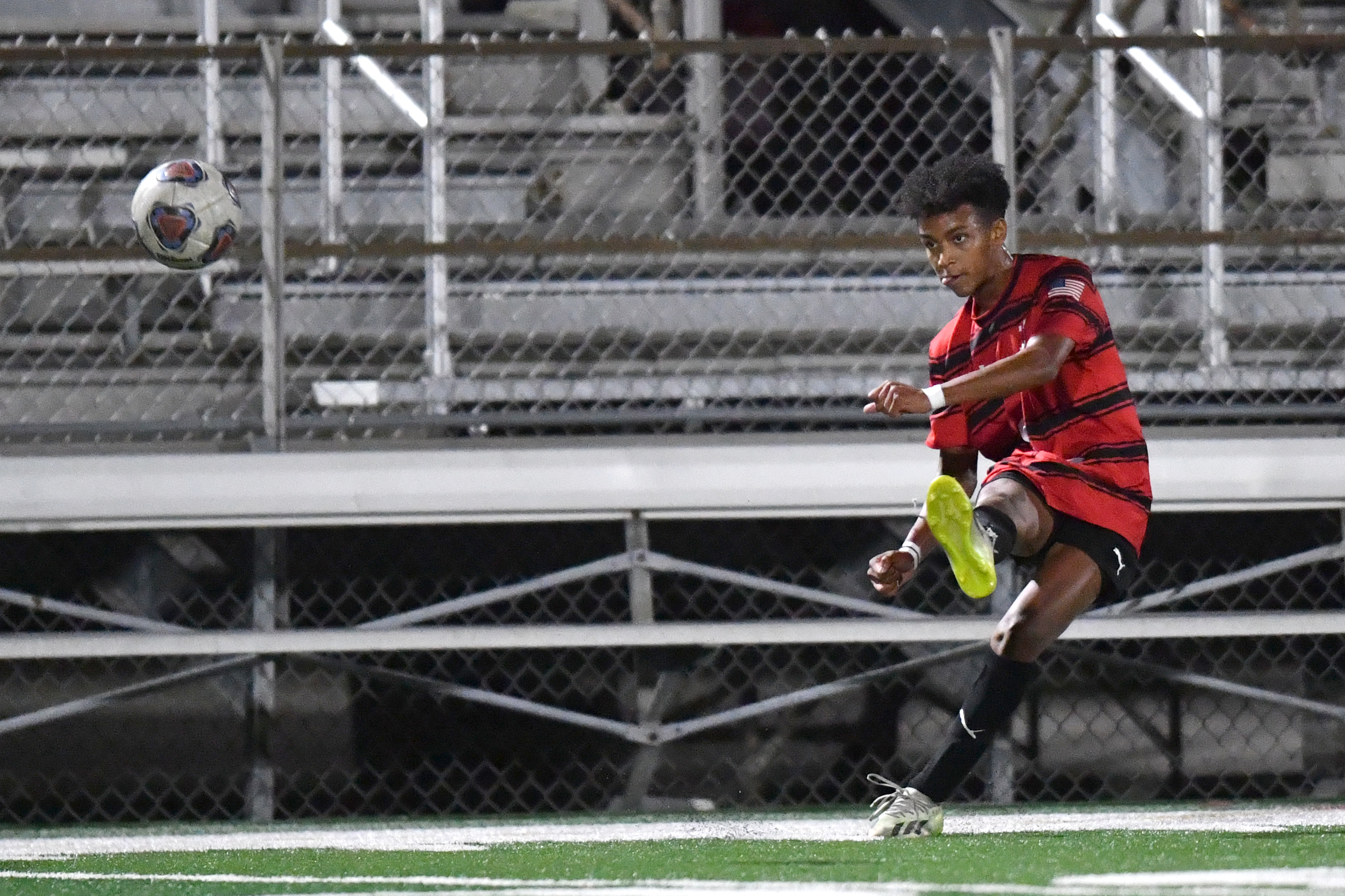 Marist RedHawks Jordan Easterling (9) kicks the ball during the second half of the varsity boys' soccer match against the Marian Catholic Spartans on Wednesday, Sept. 18, 2024, in Chicago. (Patrick Gorski/for the Daily Southtown)