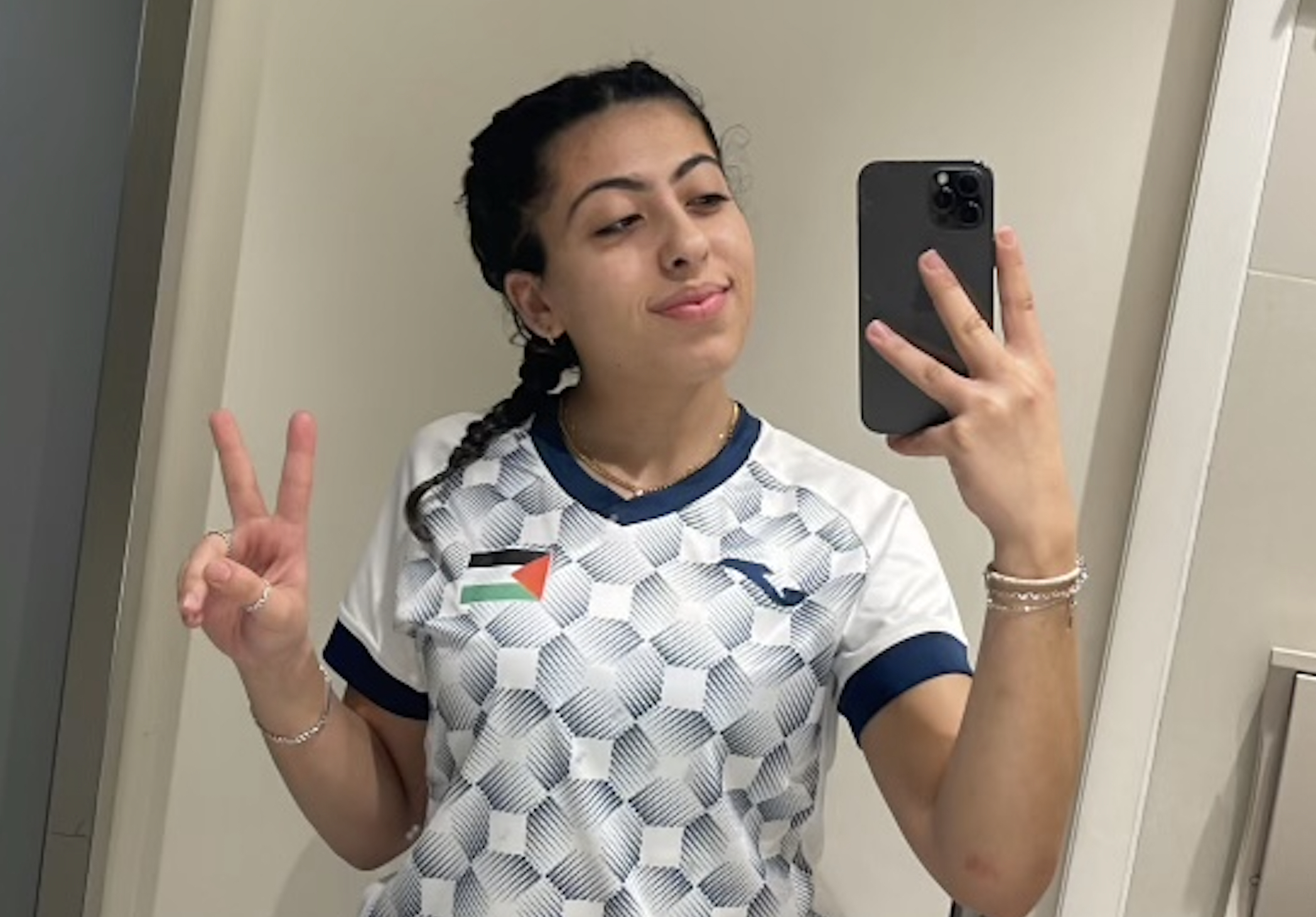 Guevara Al-Sheikh, of Orland Park, takes a selfie wearing her jersey for the Palestinian National Soccer Team. Al-Sheikh also was a member of the Moraine Valley Community College soccer team. (Guevara Al-Sheikh)