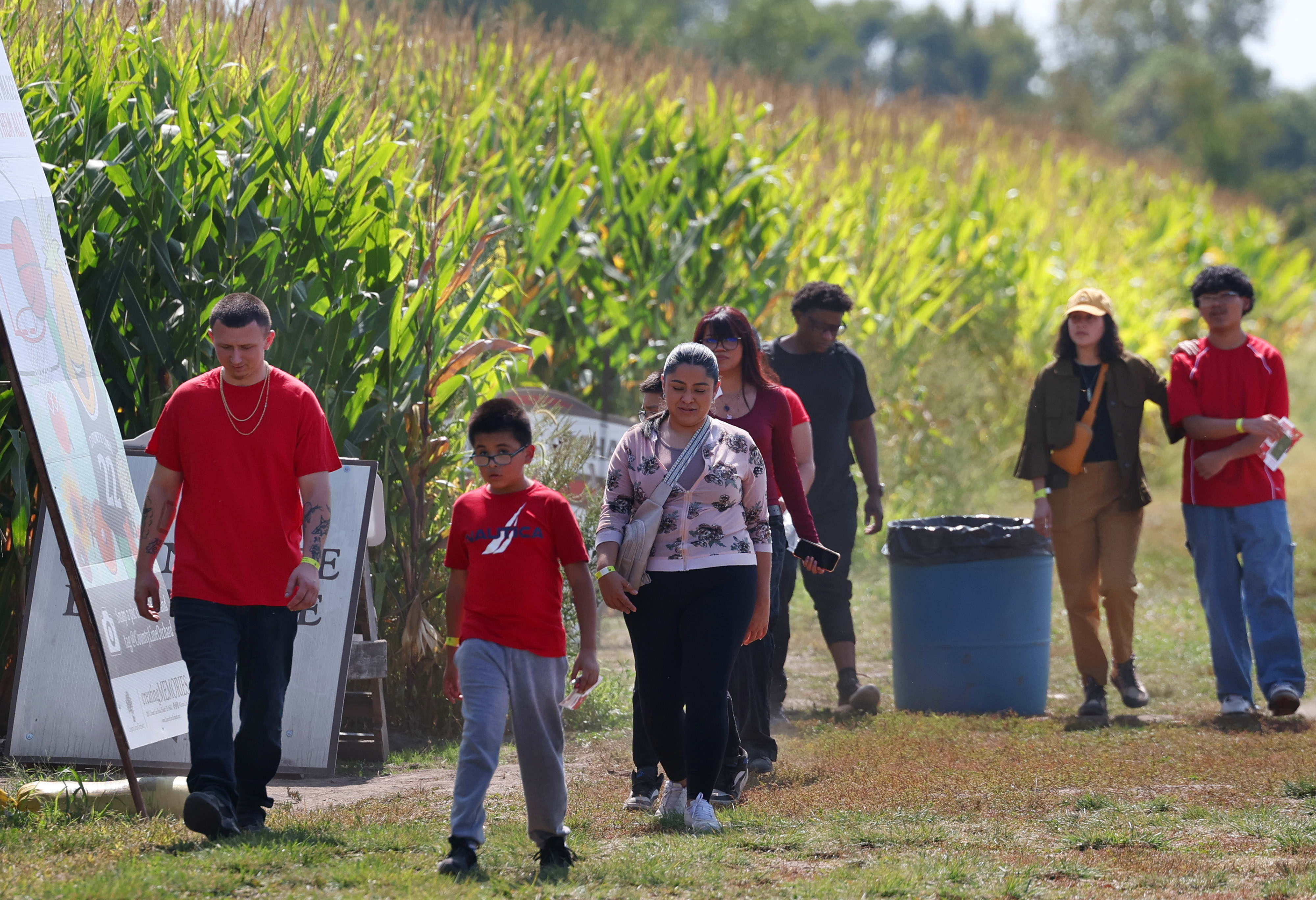 Members of the Mendoza and Brosmore families exit the Caitlin Clark corn maze at County Line Orchard on Sept. 12, 2024, in Hobart, Indiana. (Stacey Wescott/Chicago Tribune)