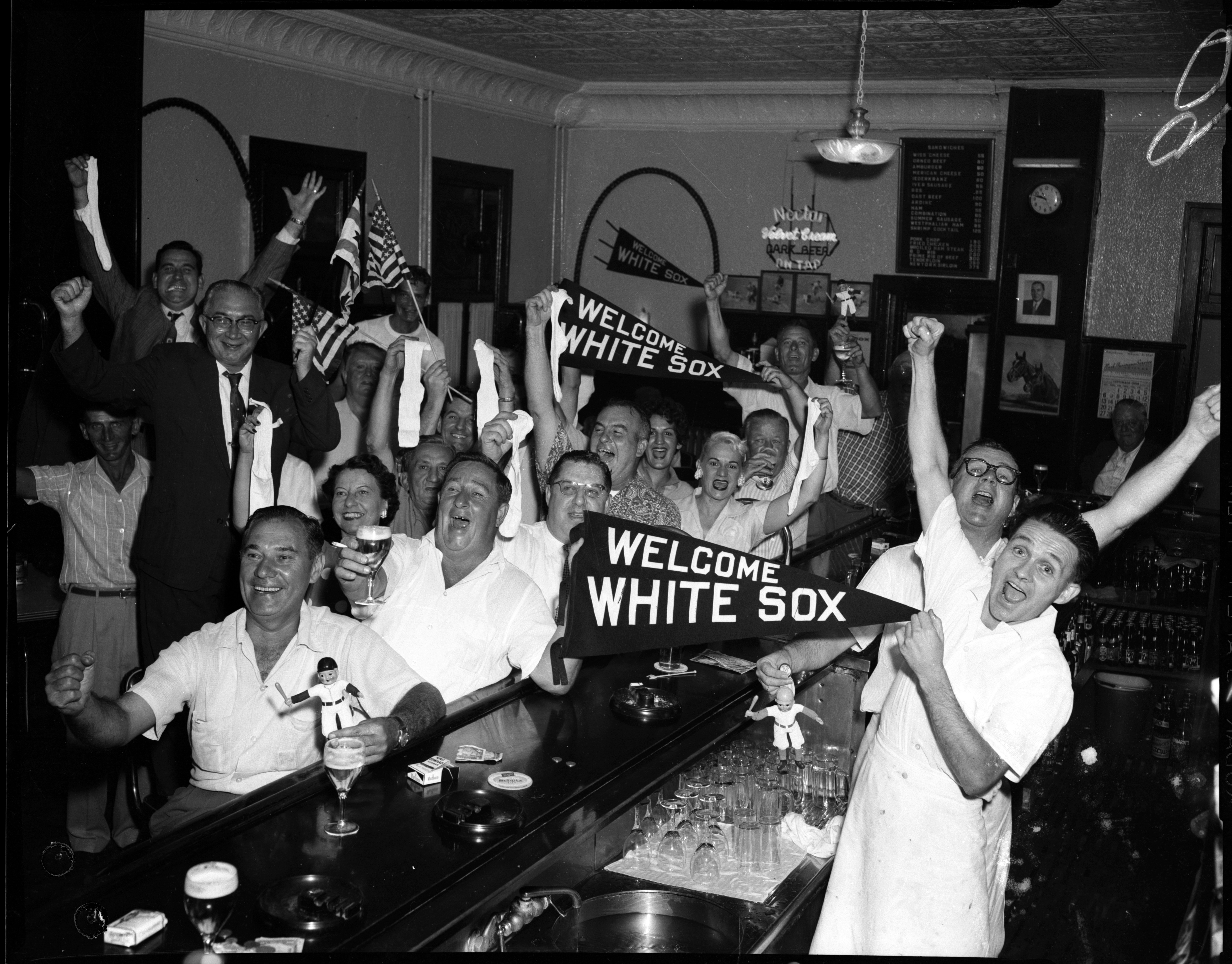 Patrons at Schaller's Pump yell and scream as the White Sox win their first pennant in 40 years on Sept. 22, 1959. Schaller's Pump was a tavern and restaurant at 3714 S. Halsted St. in Chicago. (Al Phillips/Chicago Tribune)