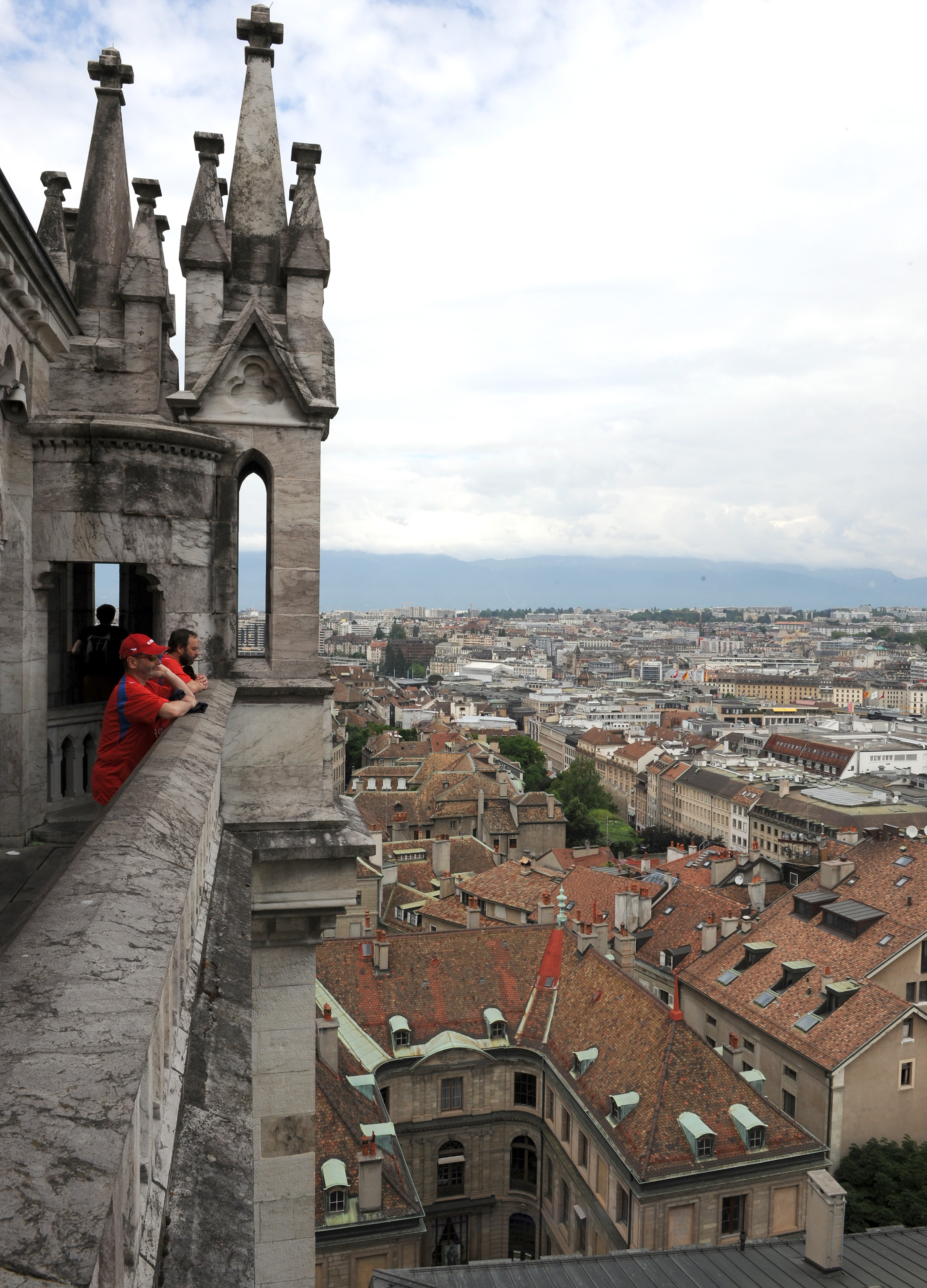 People take in the view of Geneva, Switzerland from the tower of St. Pierre Cathedral. (Anthony Devlin/Getty)