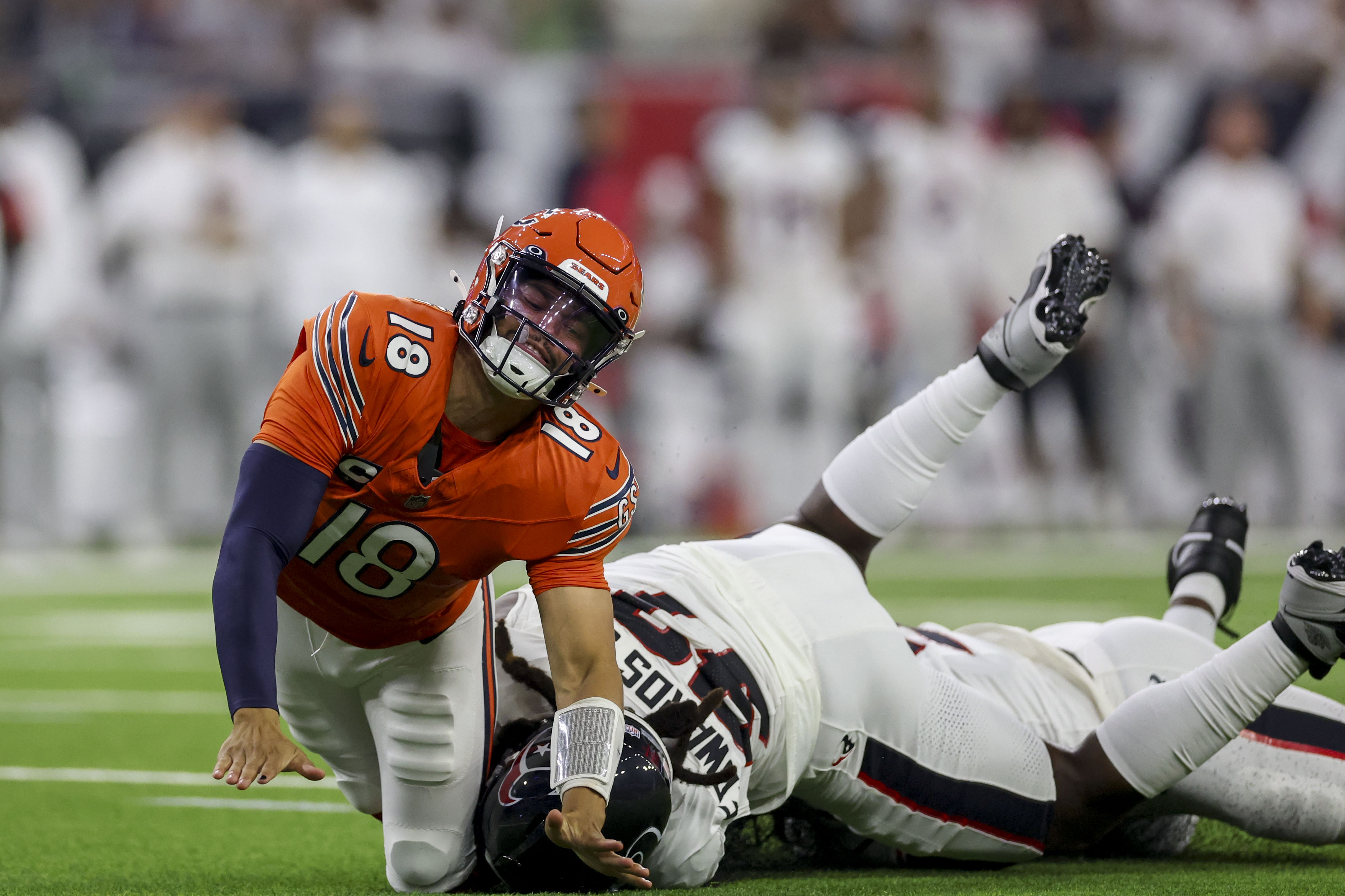 Texans defensive end Mario Edwards Jr. hits Bears quarterback Caleb Williams after he threw an incomplete pass during the second quarter at NRG Stadium on Sunday Sept. 15, 2024, in Houston. (Armando L. Sanchez/Chicago Tribune)