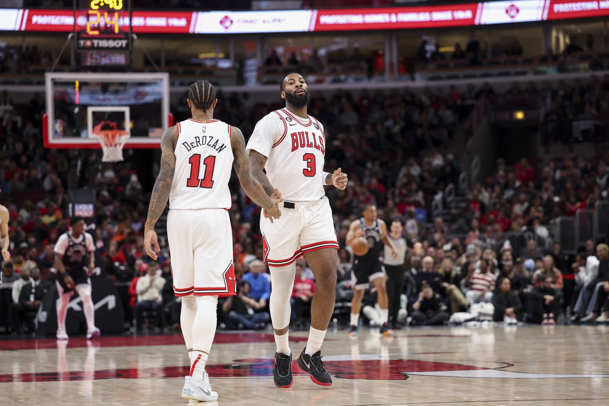 Bulls center Andre Drummond high-fives forward DeMar DeRozan (11) during the third quarter against the Spurs at the United Center on Feb. 6, 2023. (Armando L. Sanchez/TNS/Chicago Tribune)