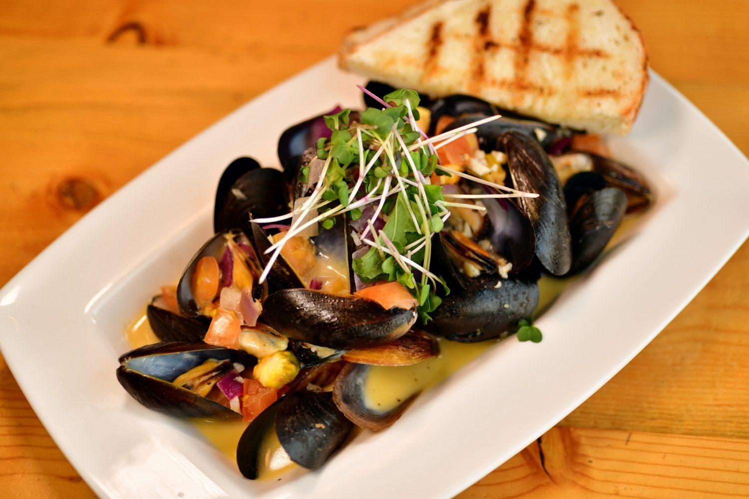 The Rose Mussels dish at The Preservery, as seen on Jan. 18, is made with PFI mussels, Colorado red onion, garlic, tomato and RosŽ butter. (Hyoung Chang, The Denver Post)