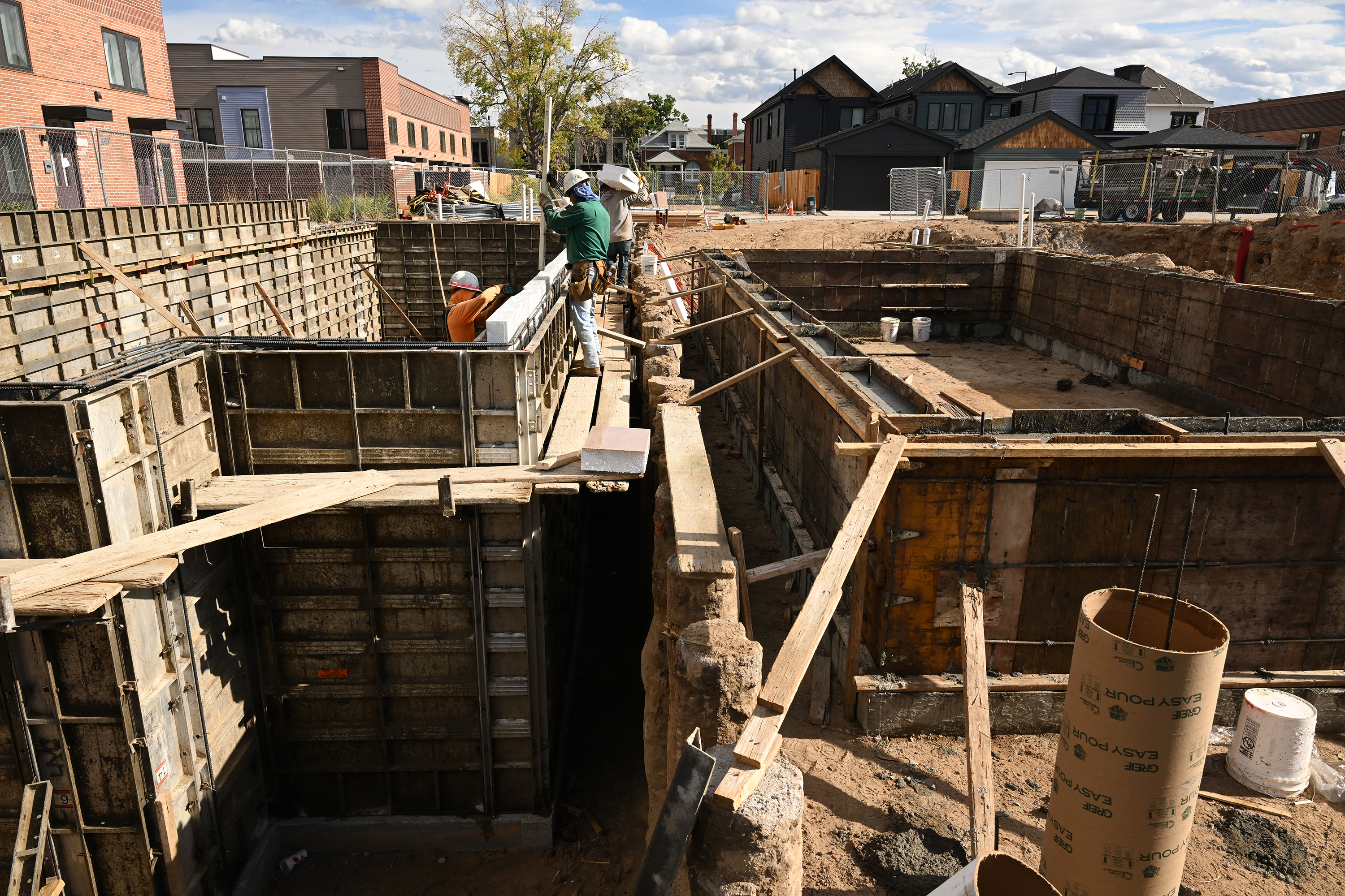 Construction workers work on the foundation ...