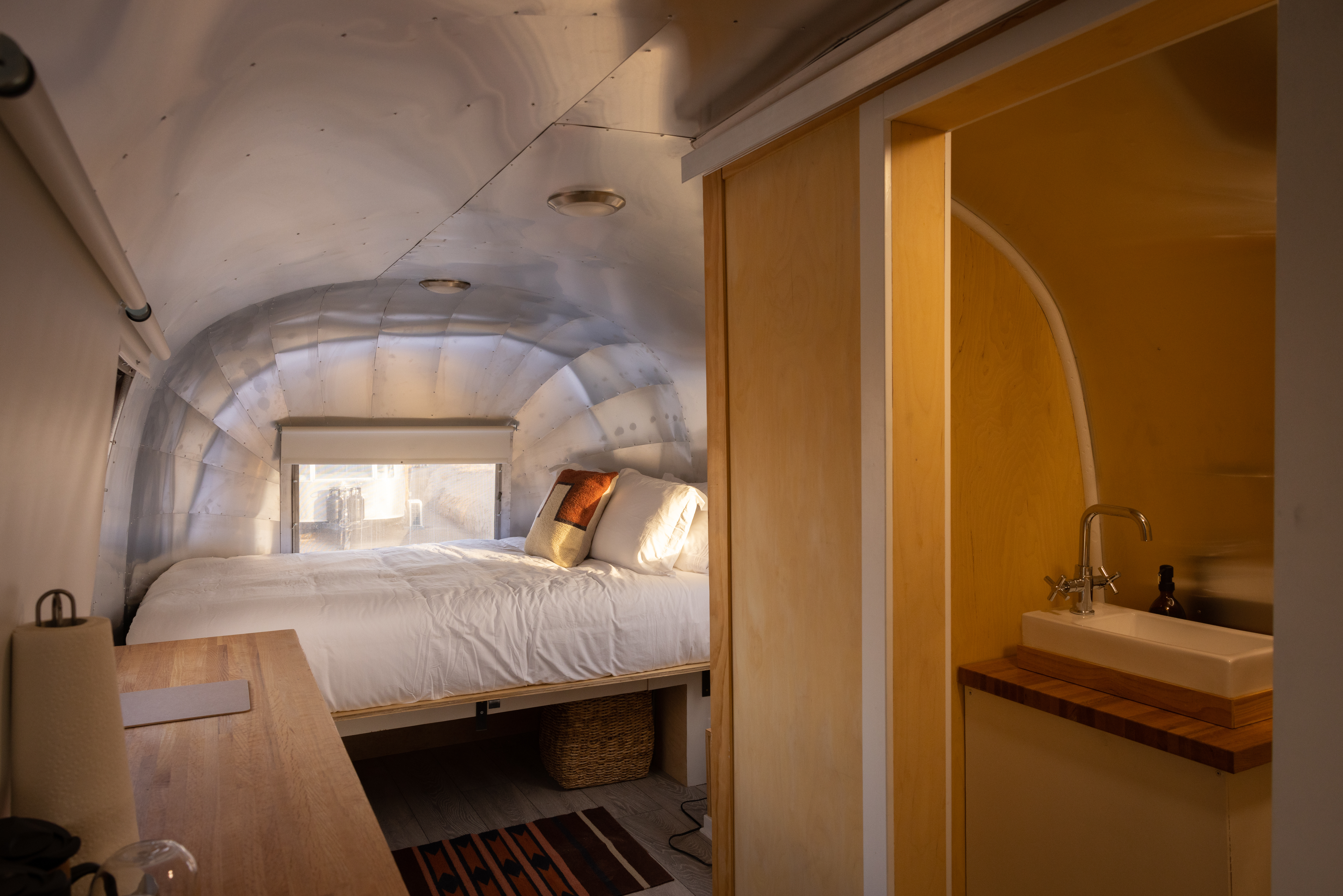 Airstreams are outfitted with small washrooms that include private toilets and sinks. Guests can access the public bath houses by the hot springs for showers. (Photo provided by Ben Knight, Desert Reef)