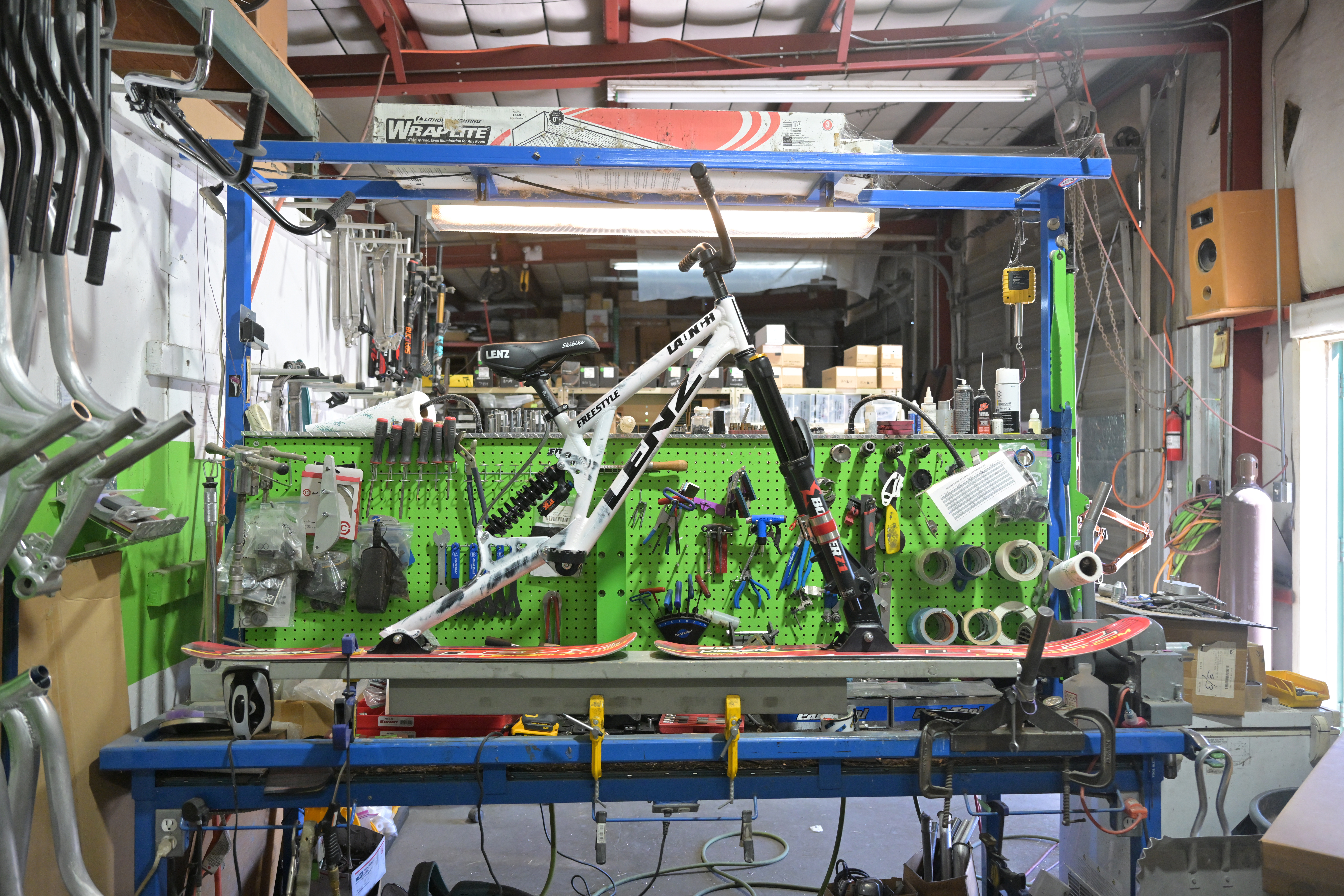 A finished ski bike made by Devin Lenz sits on a work bench this week in his workshop in Fort Lupton. (RJ Sangosti/The Denver Post)